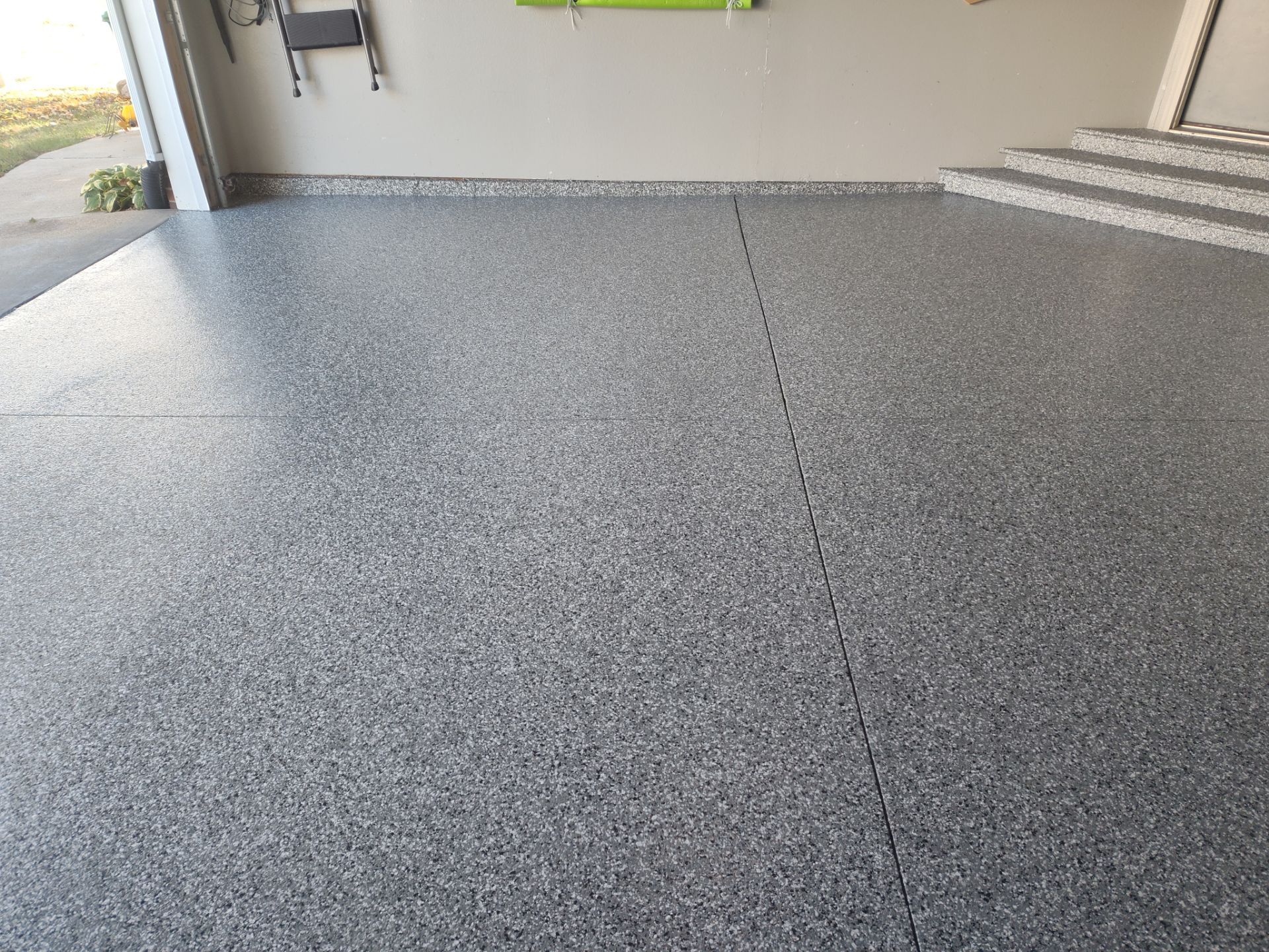 Close Up View of This Customer's New Flake Coating by Revival Concrete Coatings