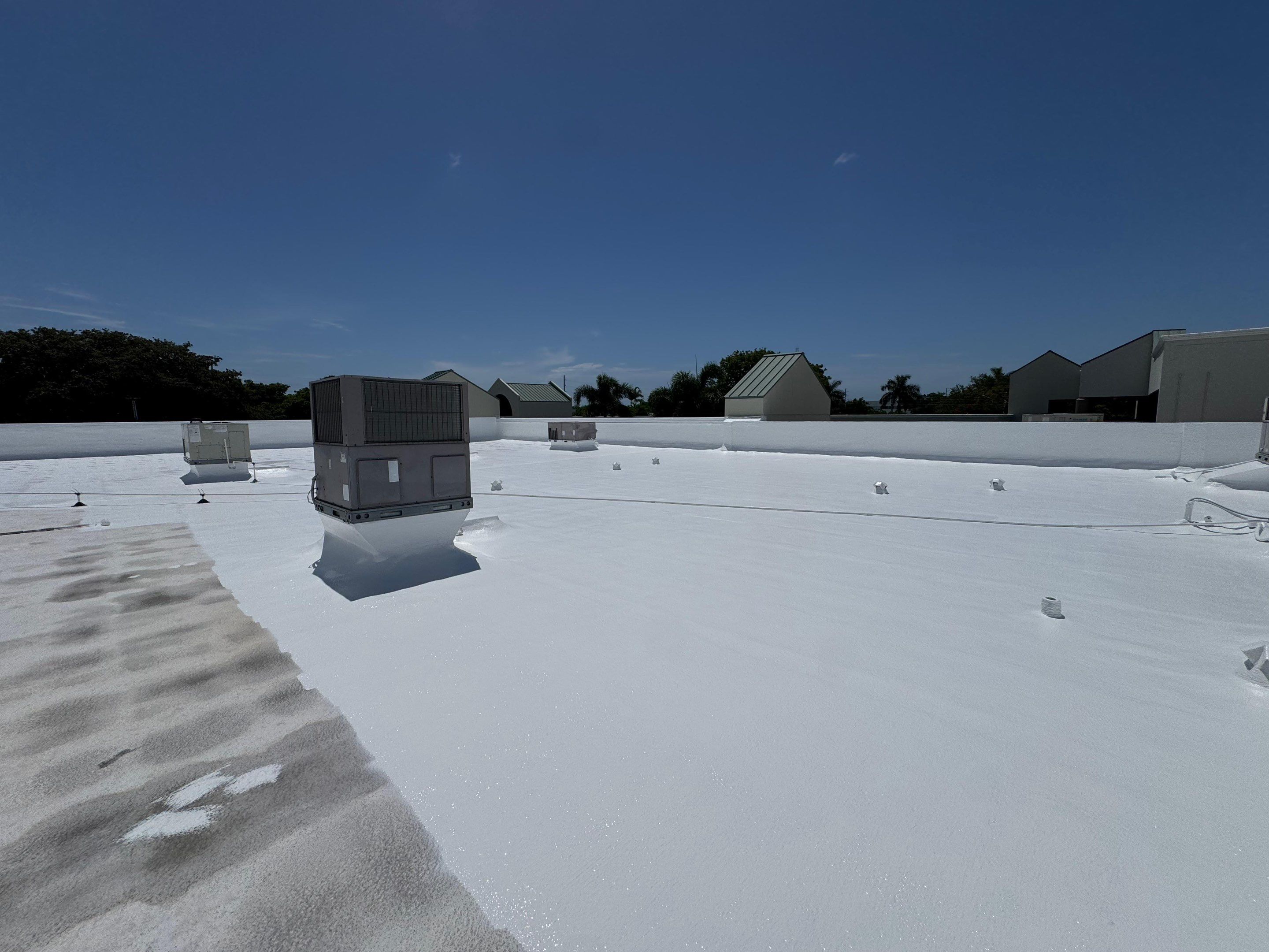 Commercial Flat Roof Restoration and Elastomeric Waterproofing in Delray Beach by Roof King LLC