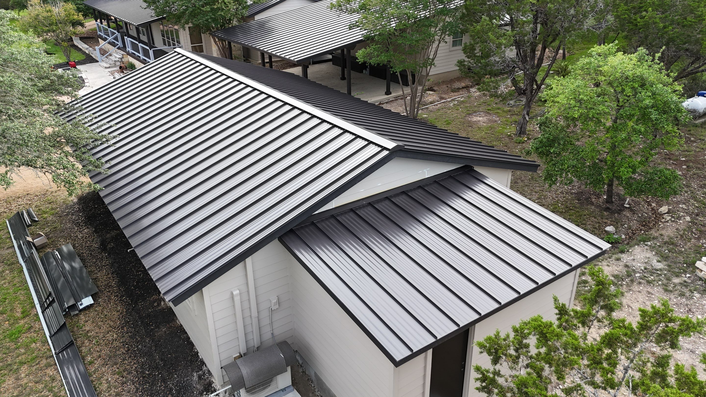 Dark Bronze Fully Striated panel by Wimberley Roofing