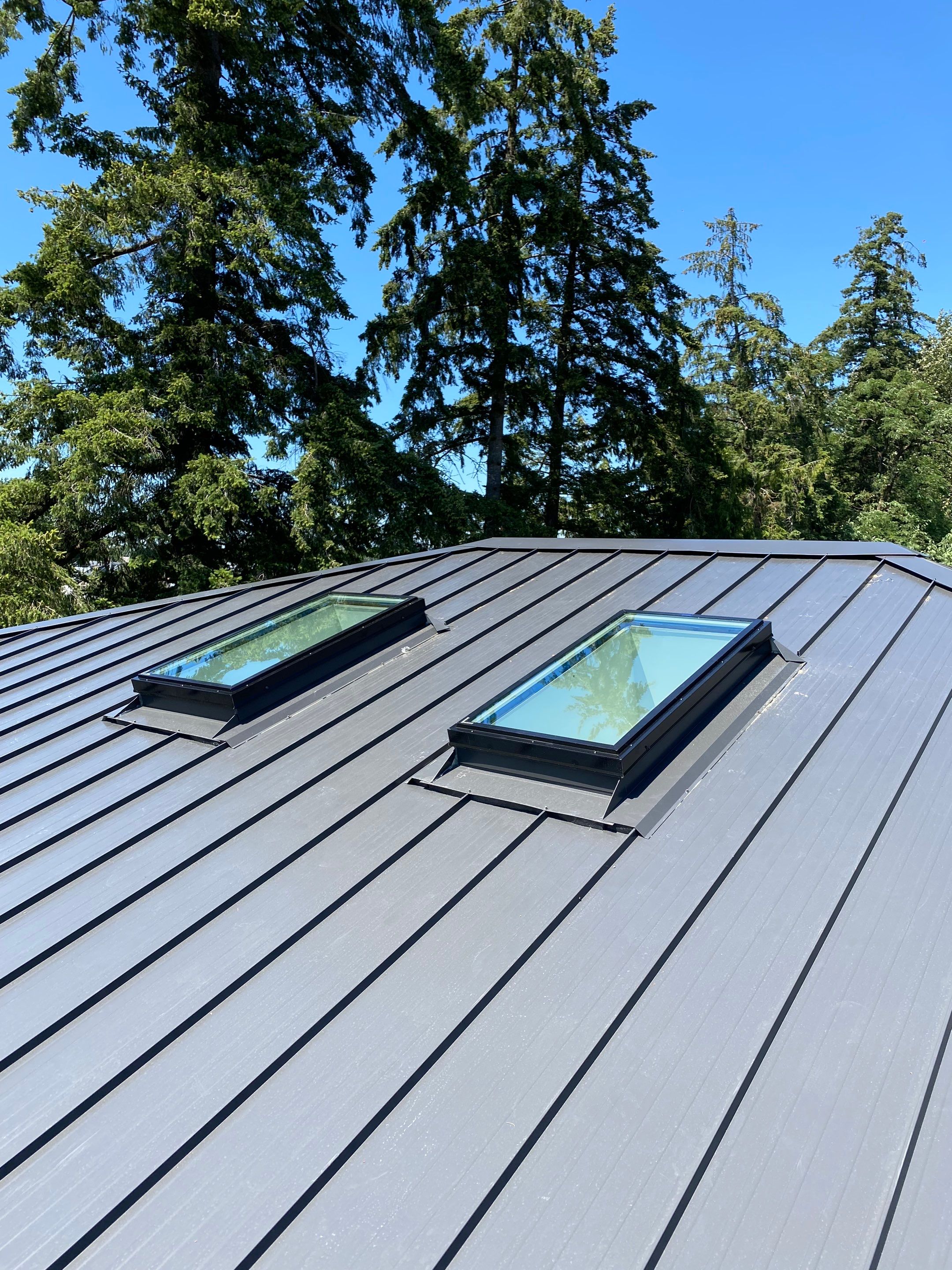 Residential Roofing Installation using 12" Prolok metal  by Top Notch Roofing Inc