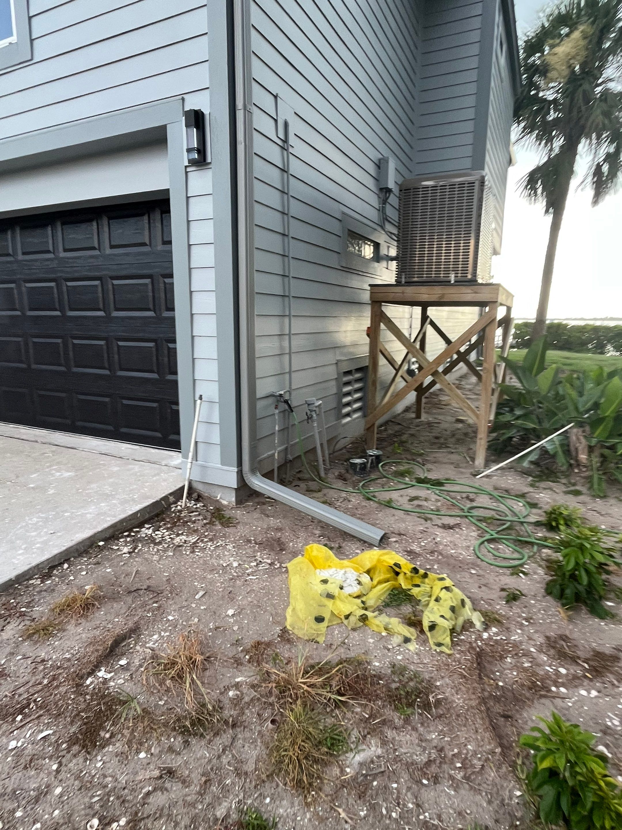 Downspout Installation Dove Grey Palmetto FL by Gutter Professors