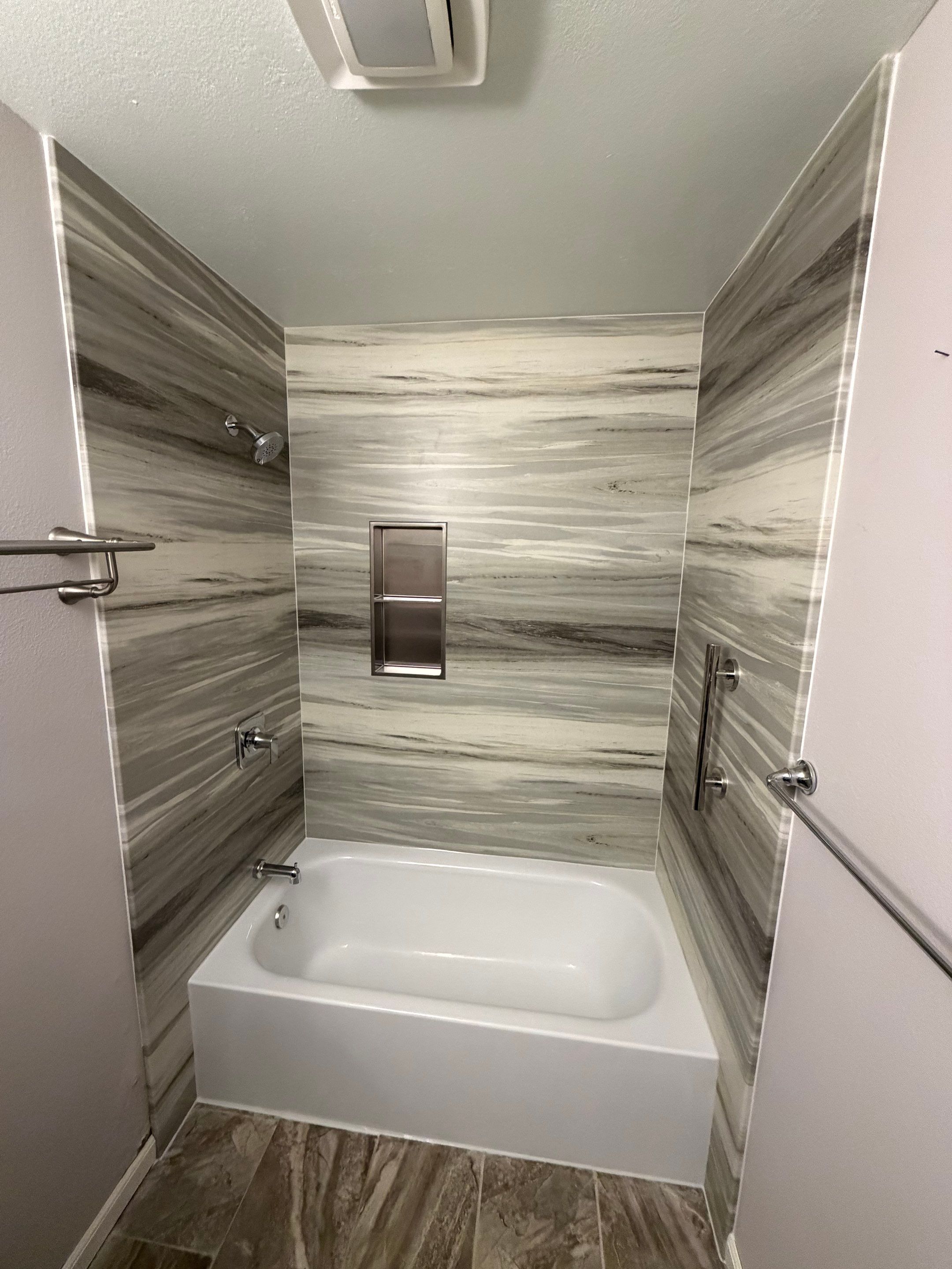 San Diego in Mira Mesa Modern Bathtub Replacement and Marble Wall Panel Installation by California Bathrooms, Inc