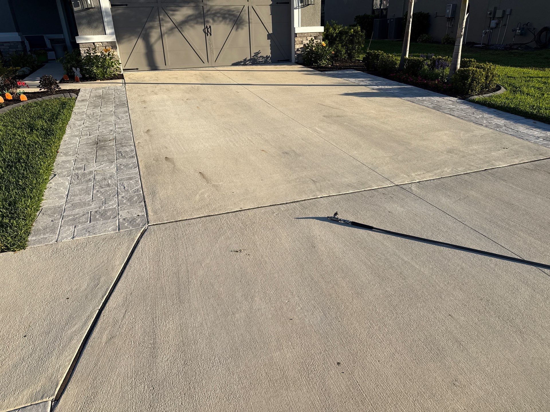 Rust Stain Removal from Concrete Driveway and Pavers in Park East at Azario | Lakewood Ranch, FL by Sunshine AquaWash