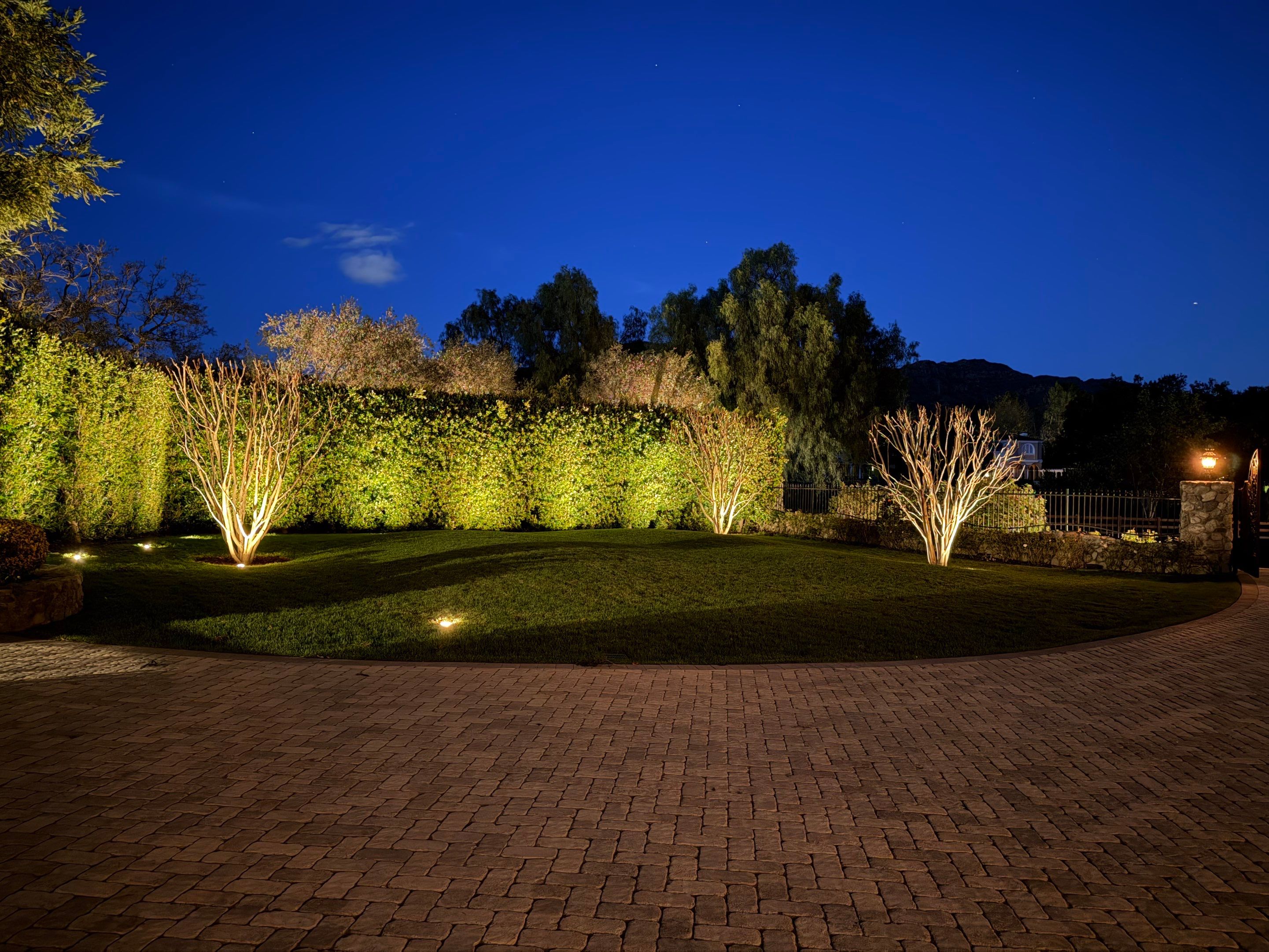 Tudor Estate Landscape Lighting with Integrated Stone Step Illumination by Outdoor Lights + Shades