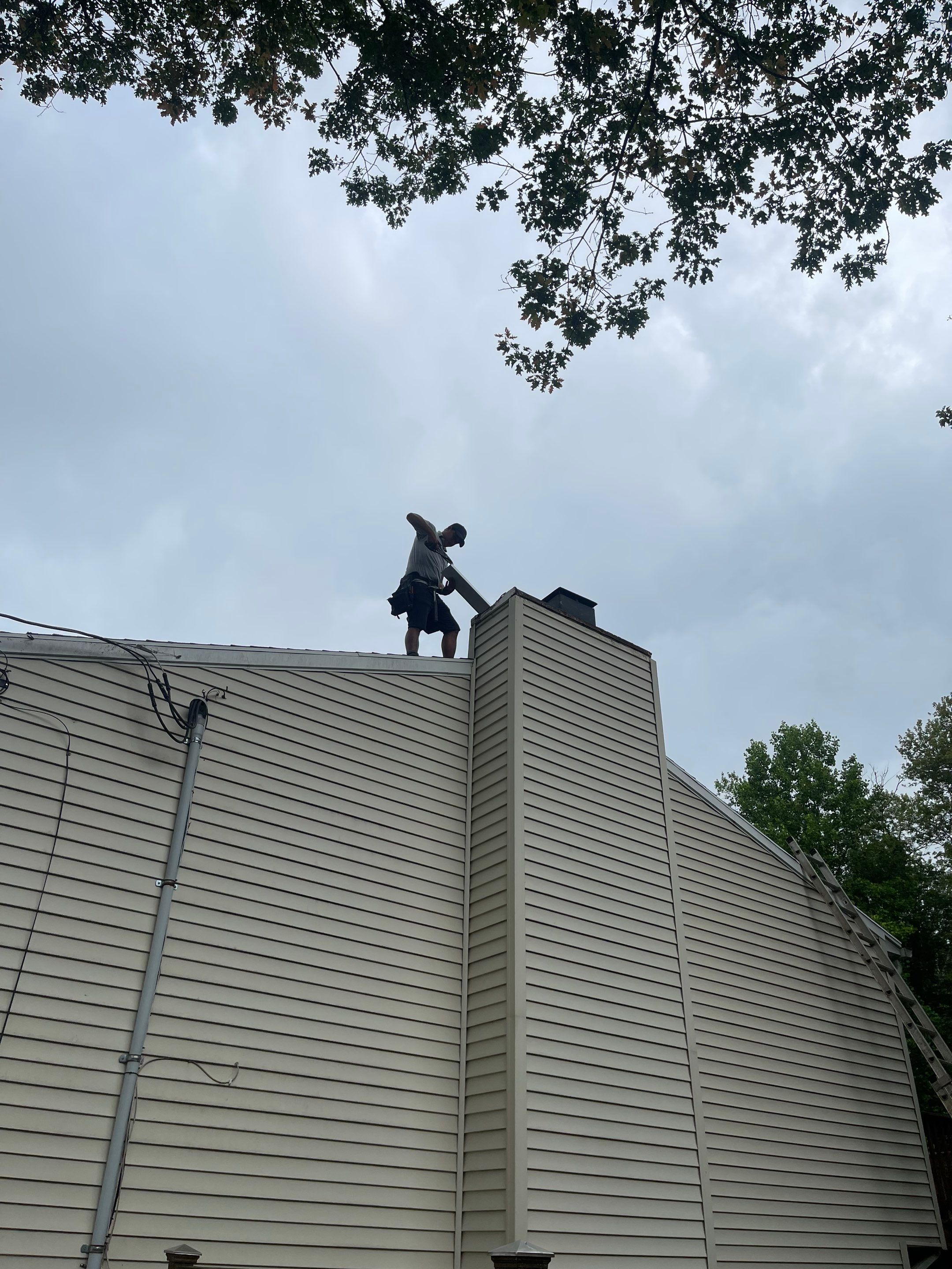 Gutter Cleaning Chimney top repair by A Plus Exterior