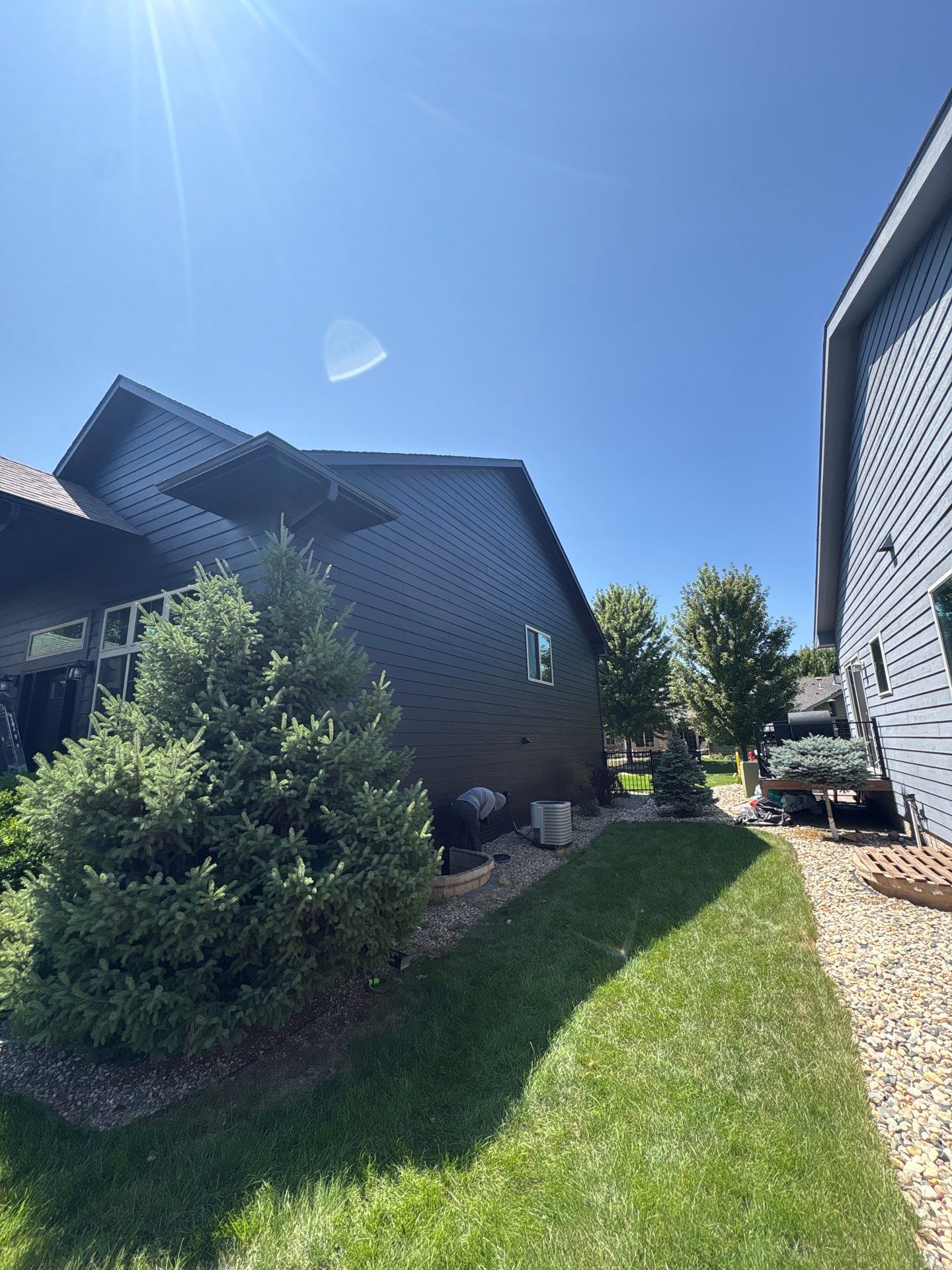 Full Exterior Siding Repaint for Sioux Falls Home and Garage by Select Painting, Coatings & Garage Cabinets