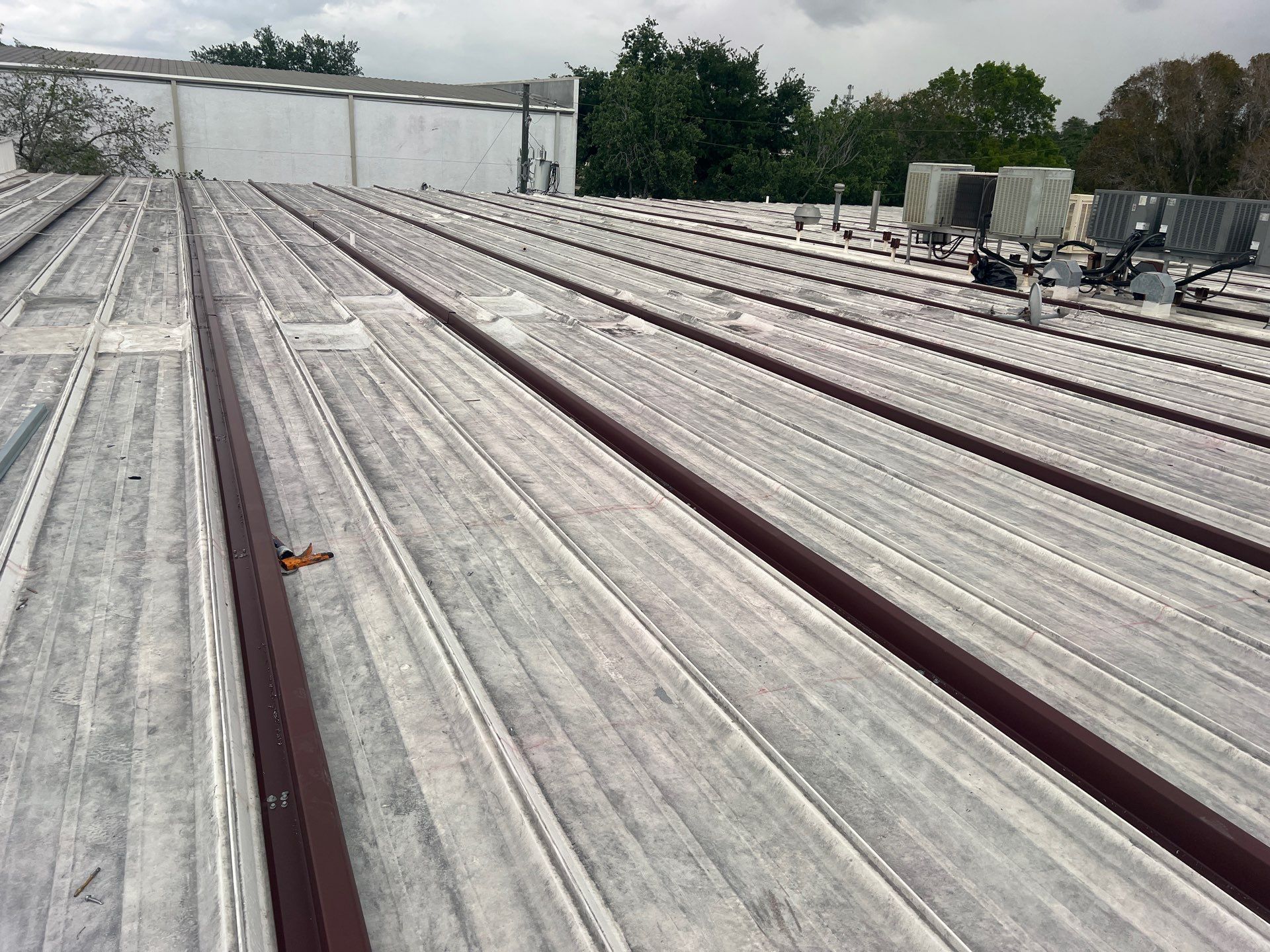 Metal-Over-Metal Roofing System by Durabilis Roofing INC