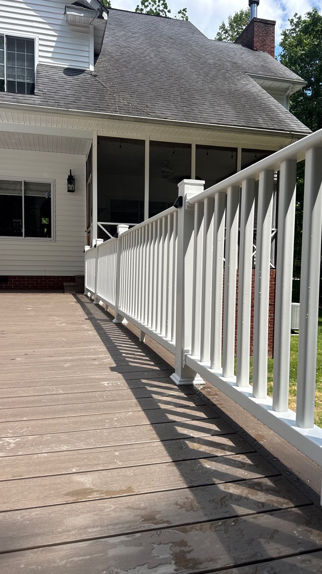 Custom Composite Deck and White Vinyl Railing Installation in Fayetteville by Walnut Hollow Decks & Outdoor Living