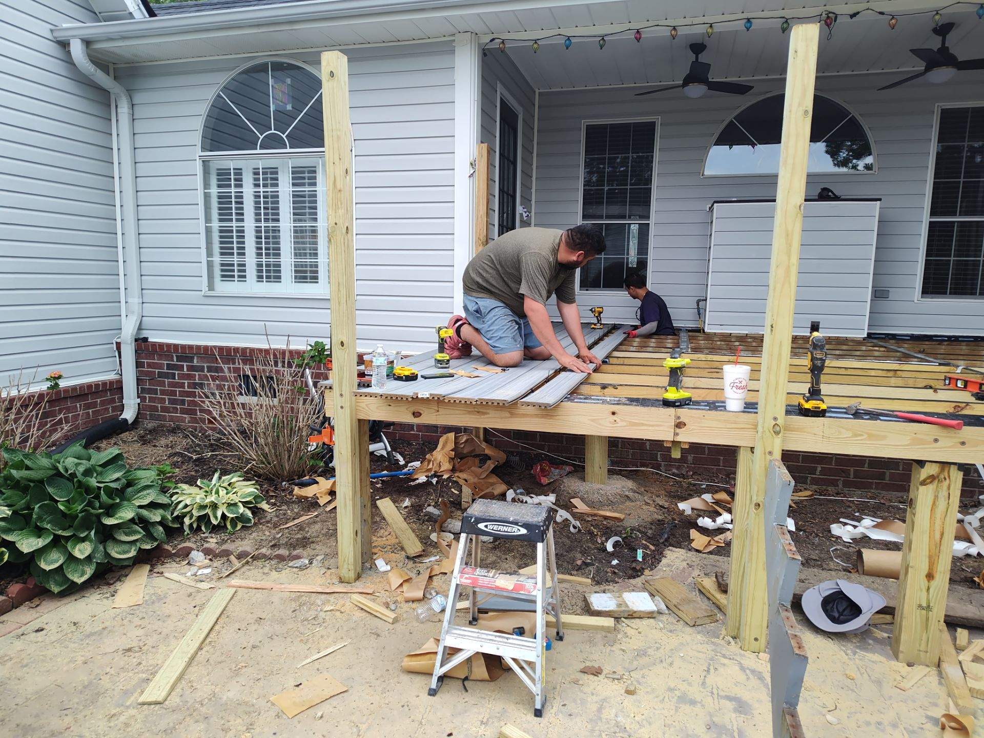 Outside porch and concreate work by Cornerstone Home Builders, LLC