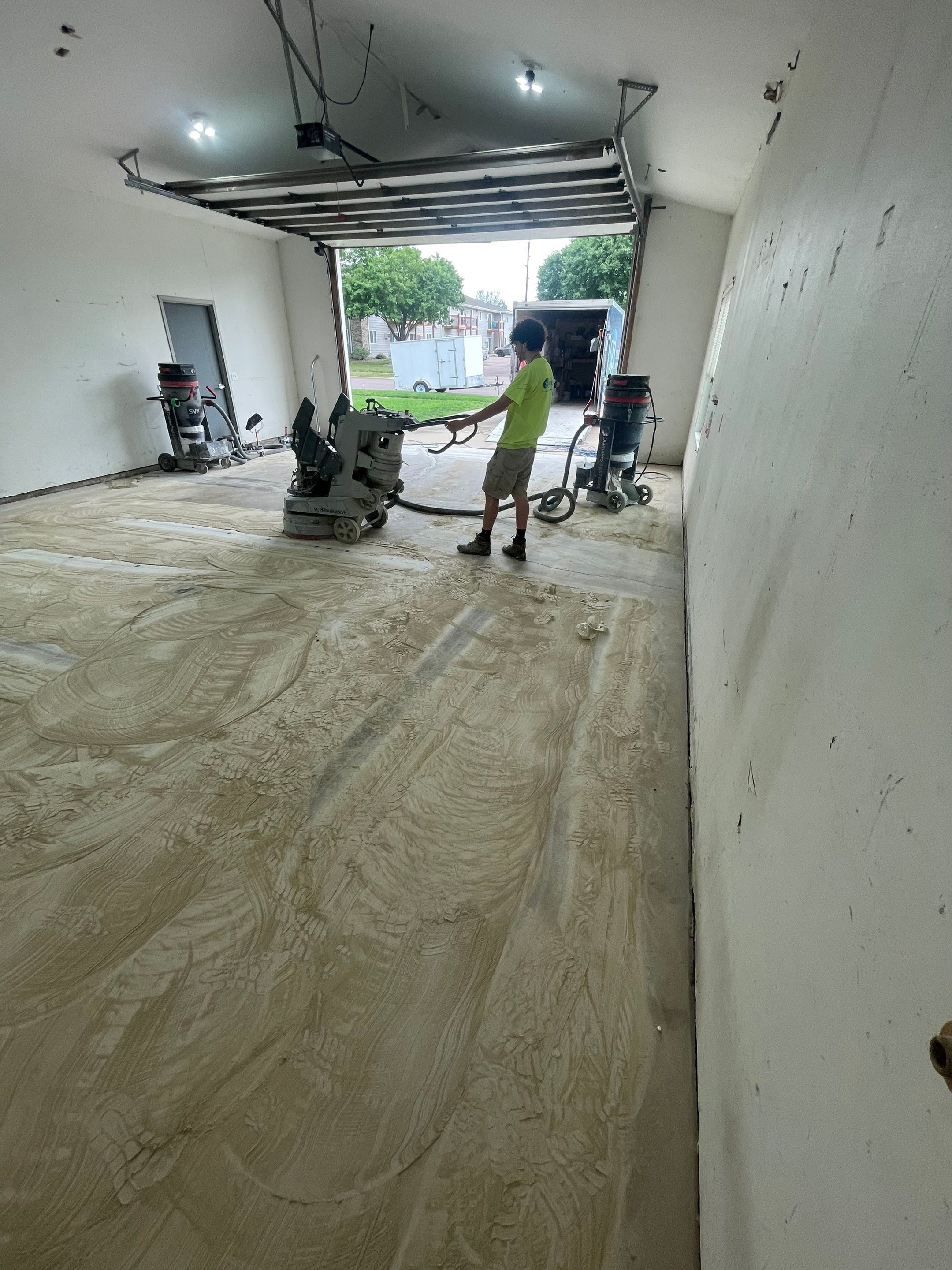 Coyote Flake Concrete Coating for Sioux Falls Garage by Select Painting, Coatings & Garage Cabinets
