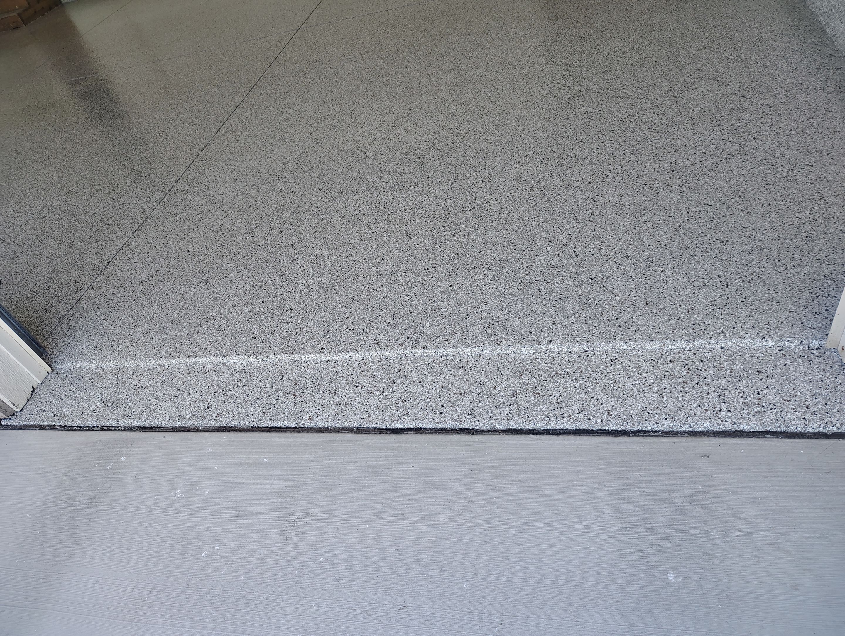 Custom Grey Speckled Epoxy Floor Coating for Sioux Falls Garage by Select Painting, Coatings & Garage Cabinets