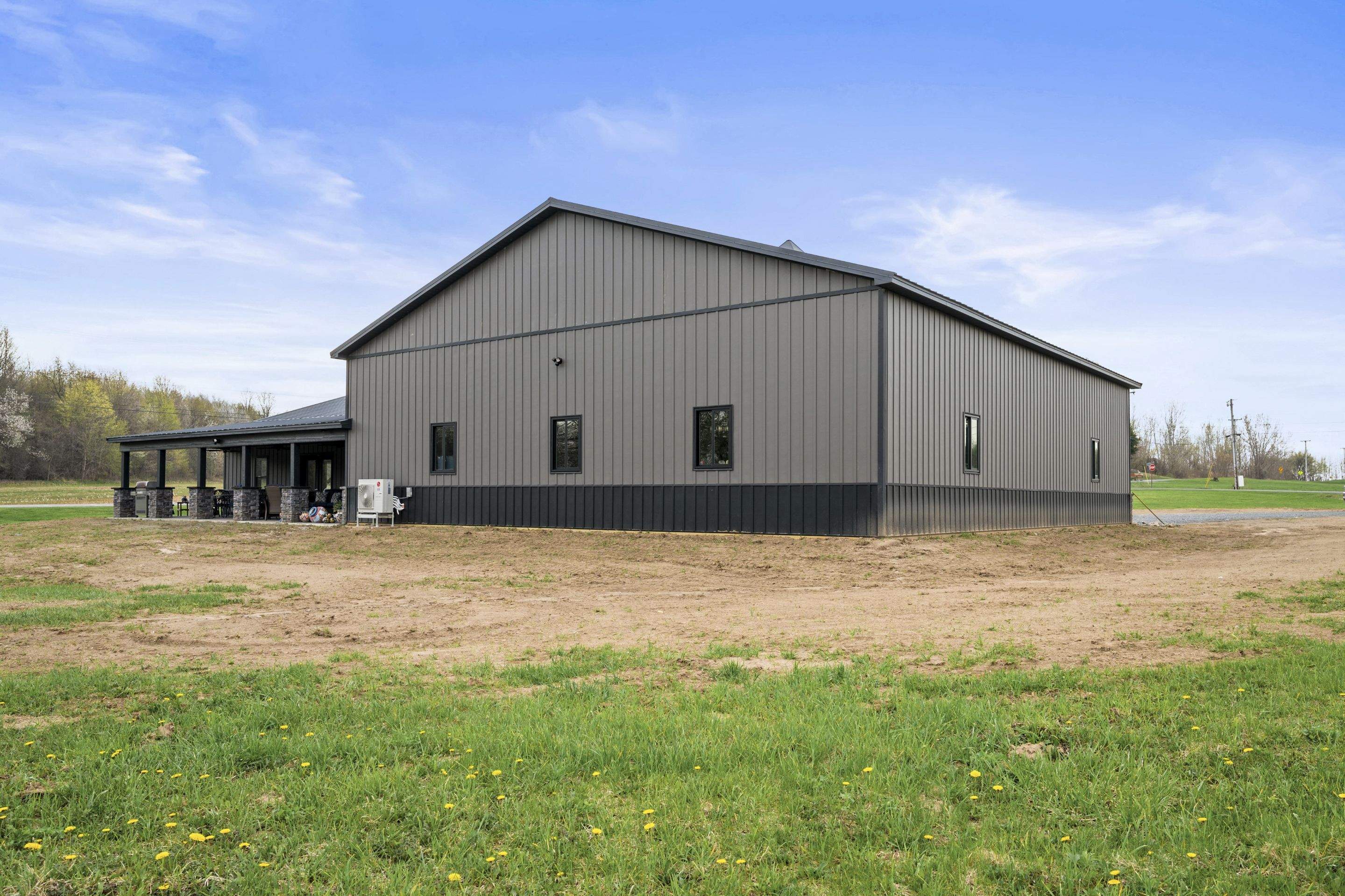Barndominium  using Textured Board & Batton by Horst Custom Homes 