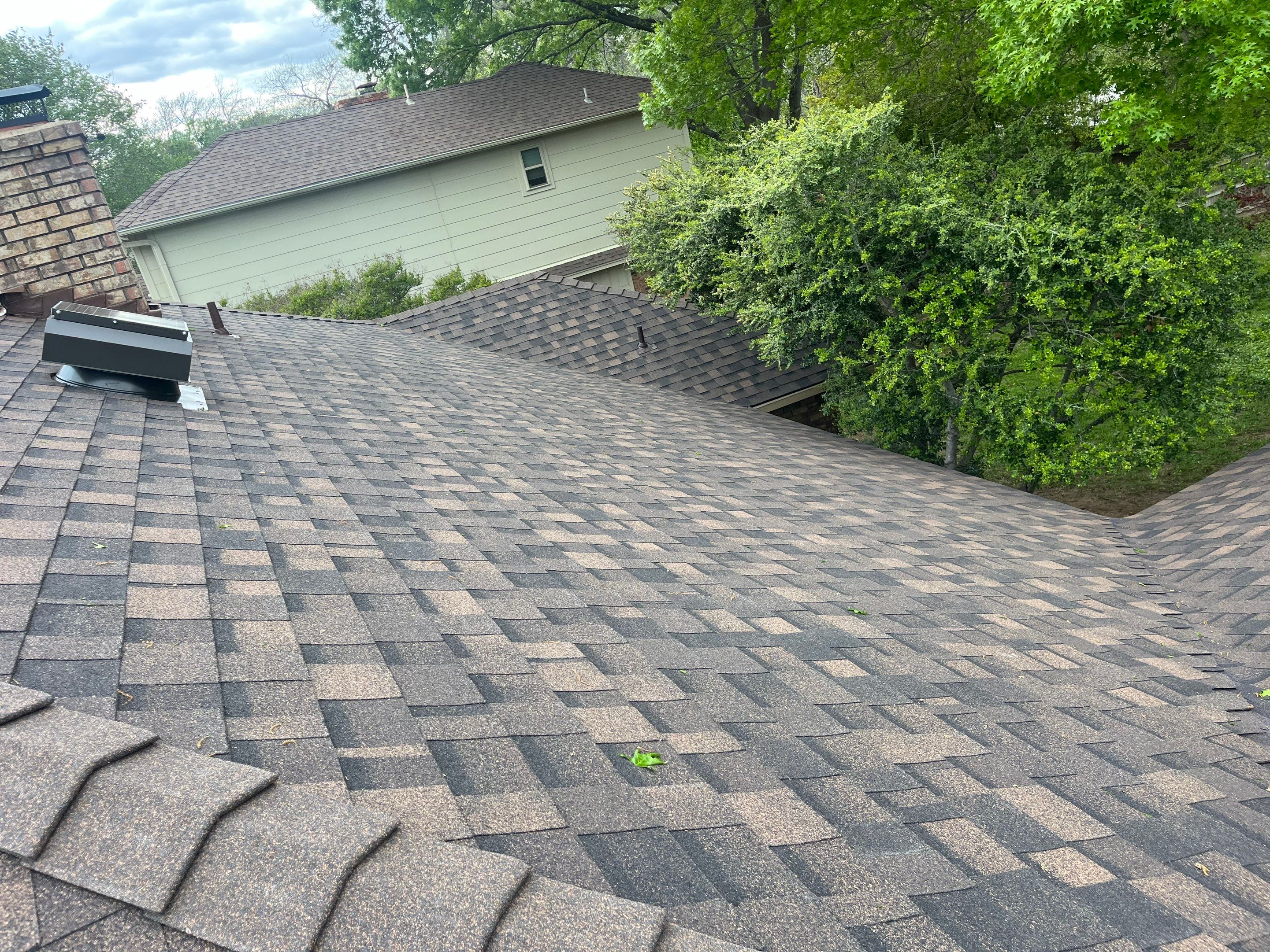 Brown brick with IKO Shadow Brown by Tejas Roofworks + Restoration
