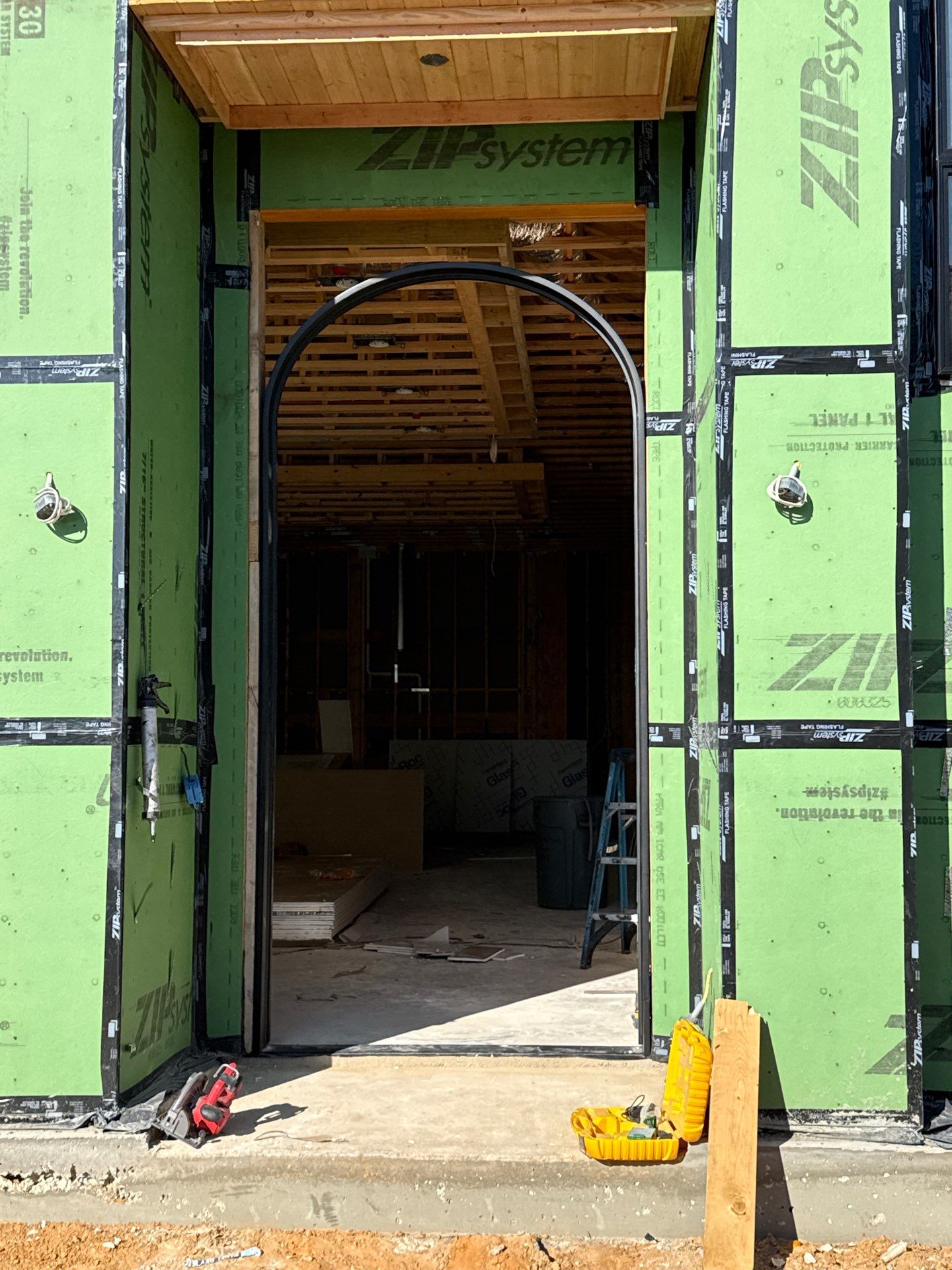 Custom Black Metal Arched Entry Door Installation in Southlake by Solara Custom Living