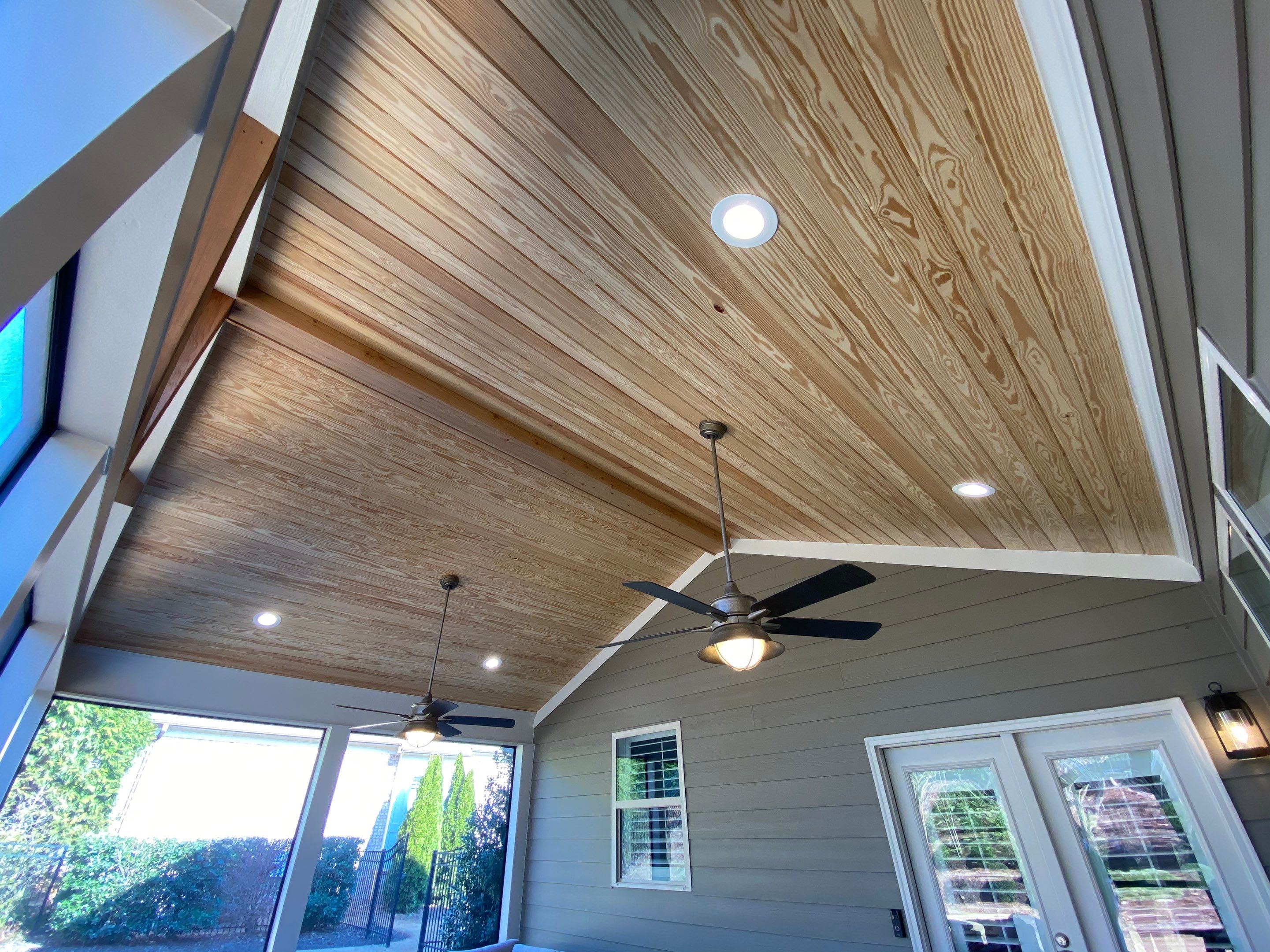 Custom Screened Porch Addition with Vaulted Wood Ceilings in Woodstock by Swift Home Renovations