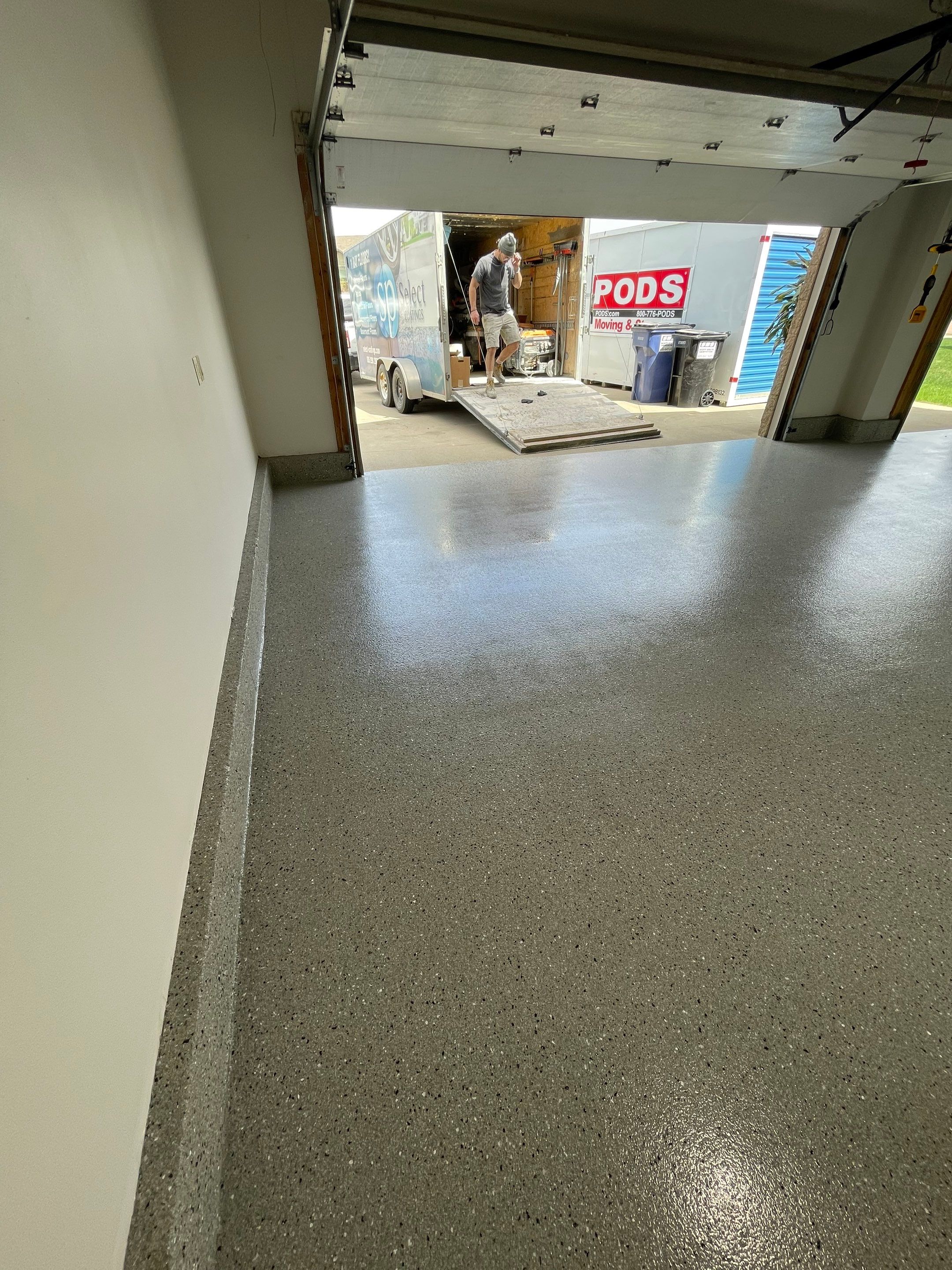 Residential Garage Floor Coating with Grey Speckled Epoxy Finish by Select Painting, Coatings & Garage Cabinets