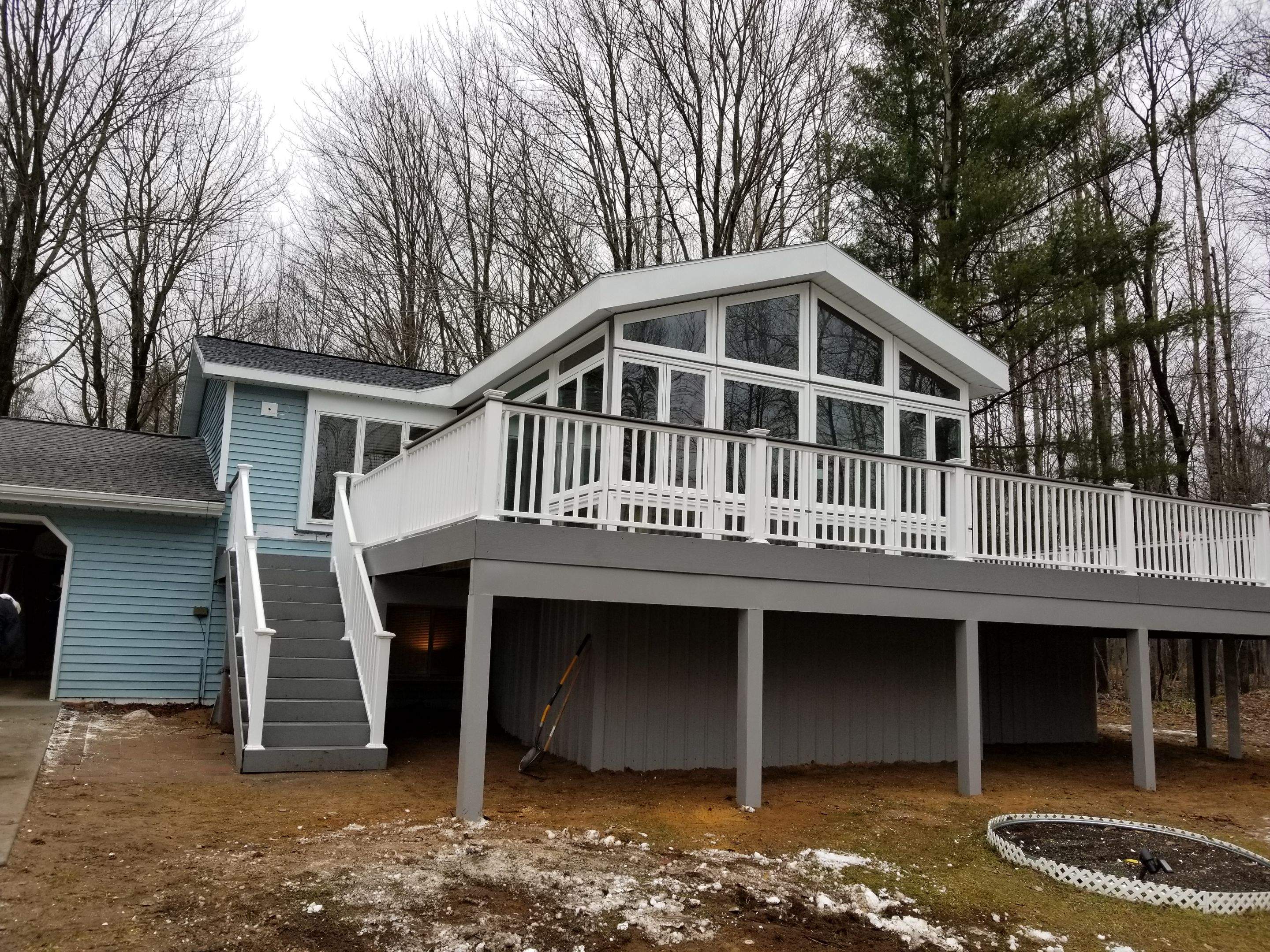 Sunroom and deck addition. by Energy Plus Home Improvements