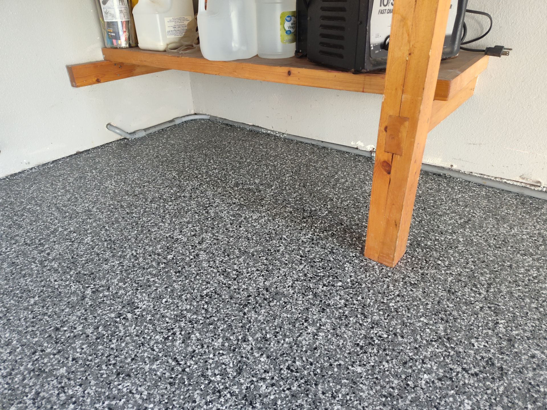 Close Up View of This Customer's New Flake Coating by Revival Concrete Coatings