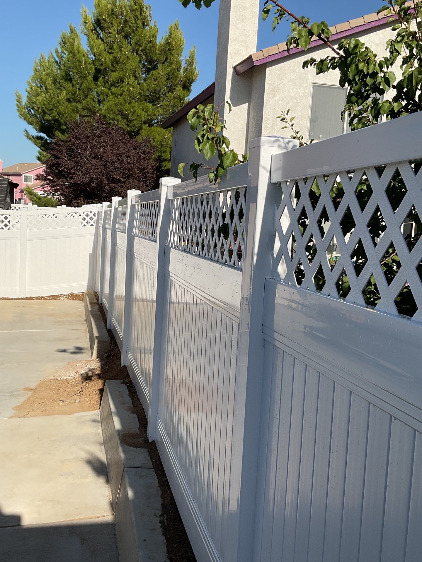 Lattice Vinyl with Privacy Vinyl Fence by Fence Guys Inc.