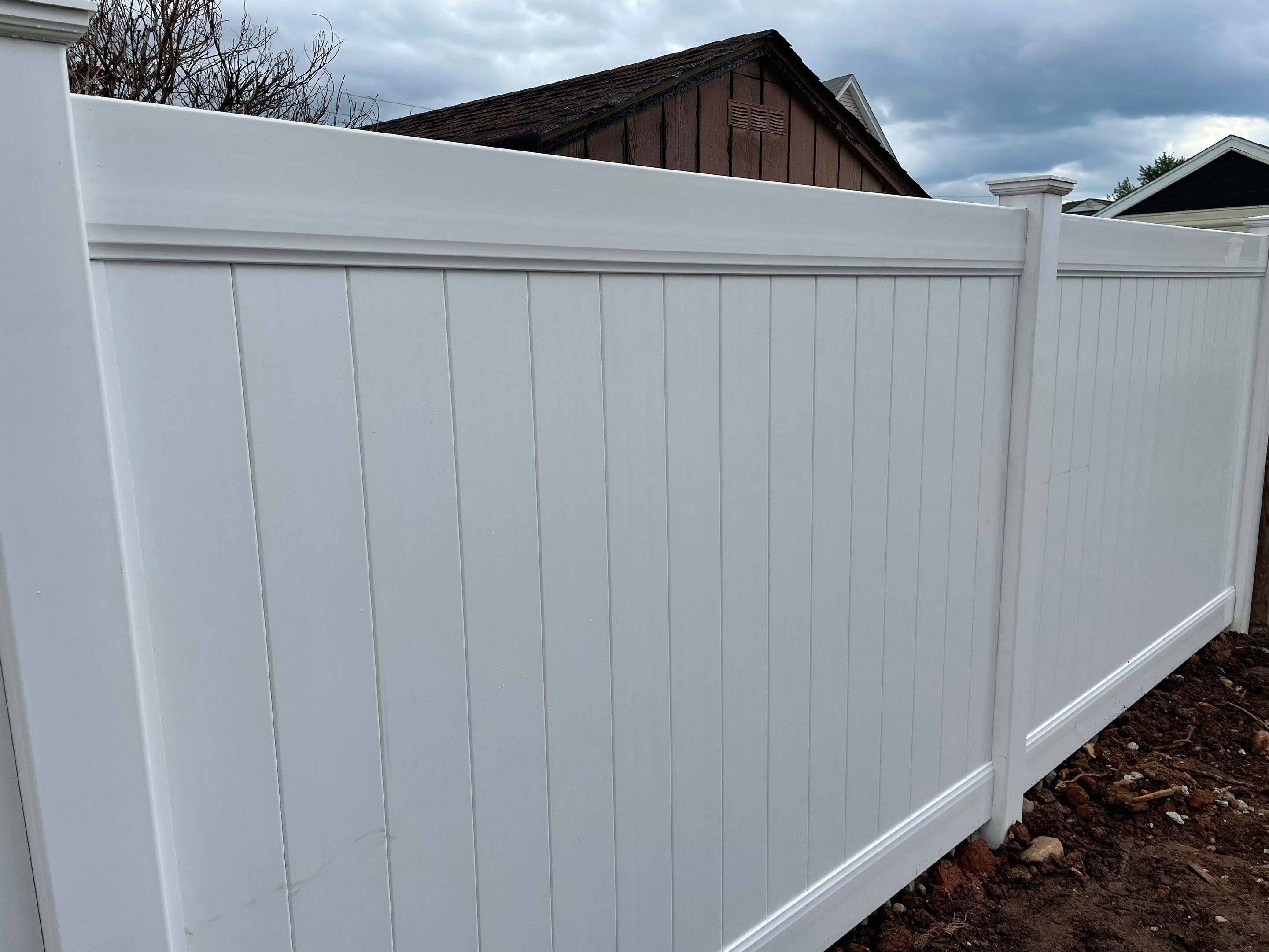 Fence Installation using White Fence by Home Concepts Construction