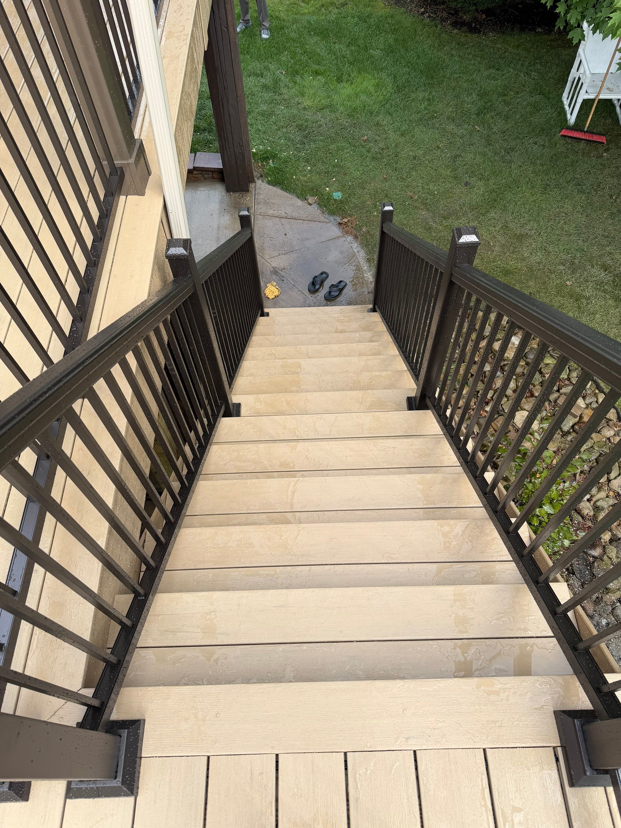 Elevated Composite Deck Installation with Covered Porch in South Park Township by Cousins Roofing Siding & Decks