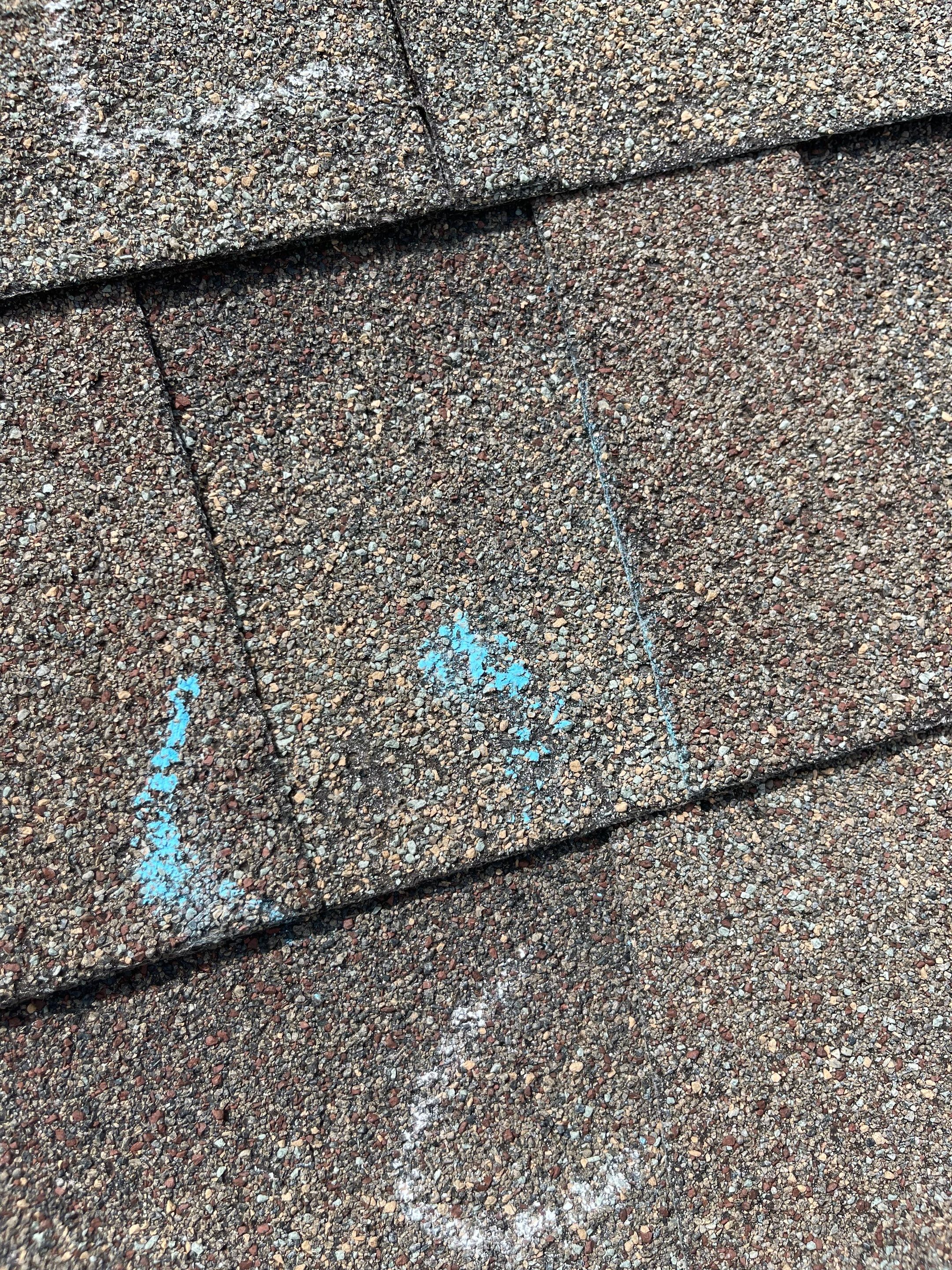 Hail Damage on a Roofing System by Icon Roofing And Construction 