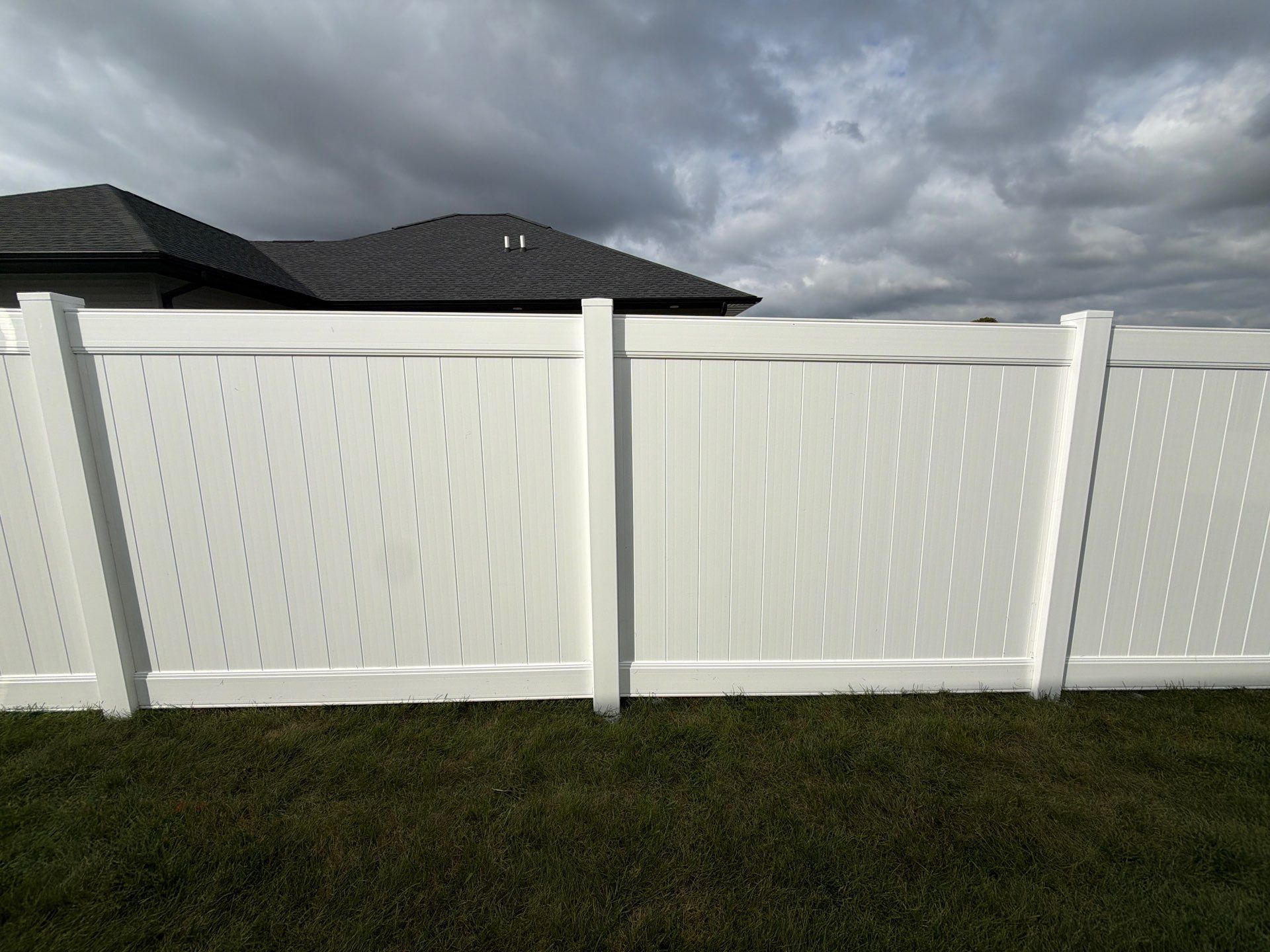 Residential White Vinyl Privacy Fence Installation in Janesville by Perfect Picket Fence and Stain