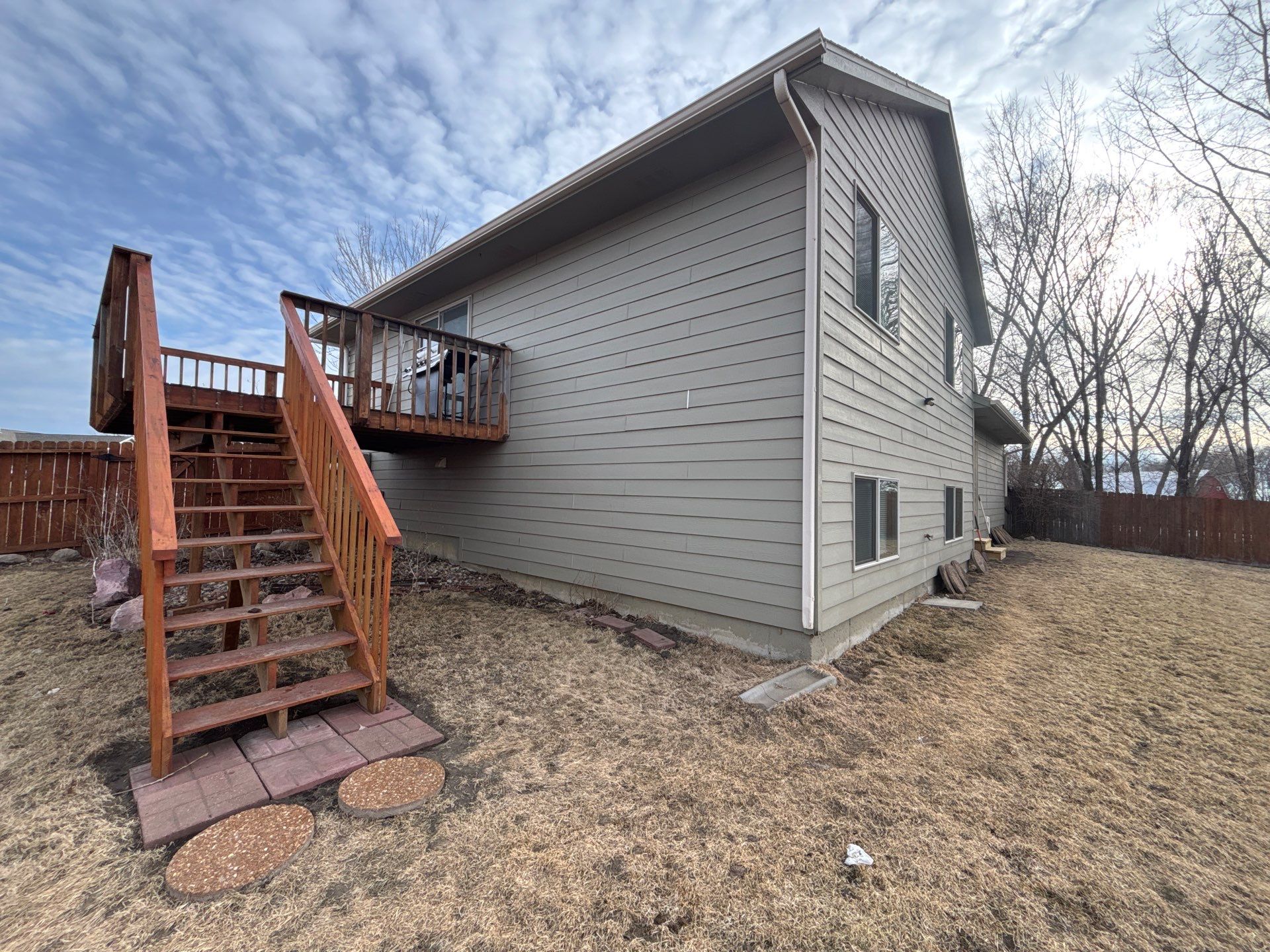 Full Exterior Residential Painting and Siding Refresh in Sioux Falls by Select Painting, Coatings & Garage Cabinets