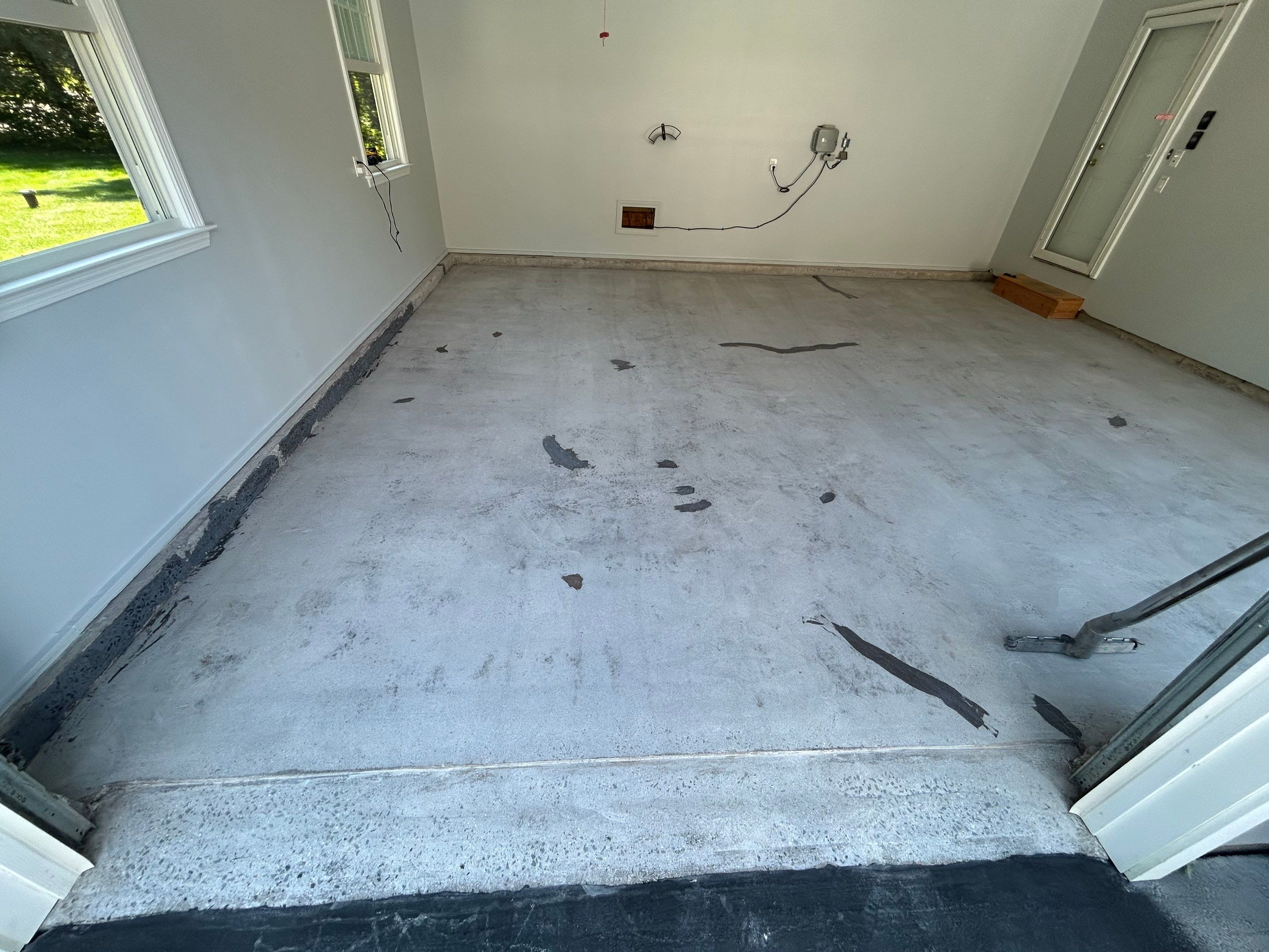 Wombat Concrete Floor Coating Transformation by DiGiorgi Roofing and Siding Inc