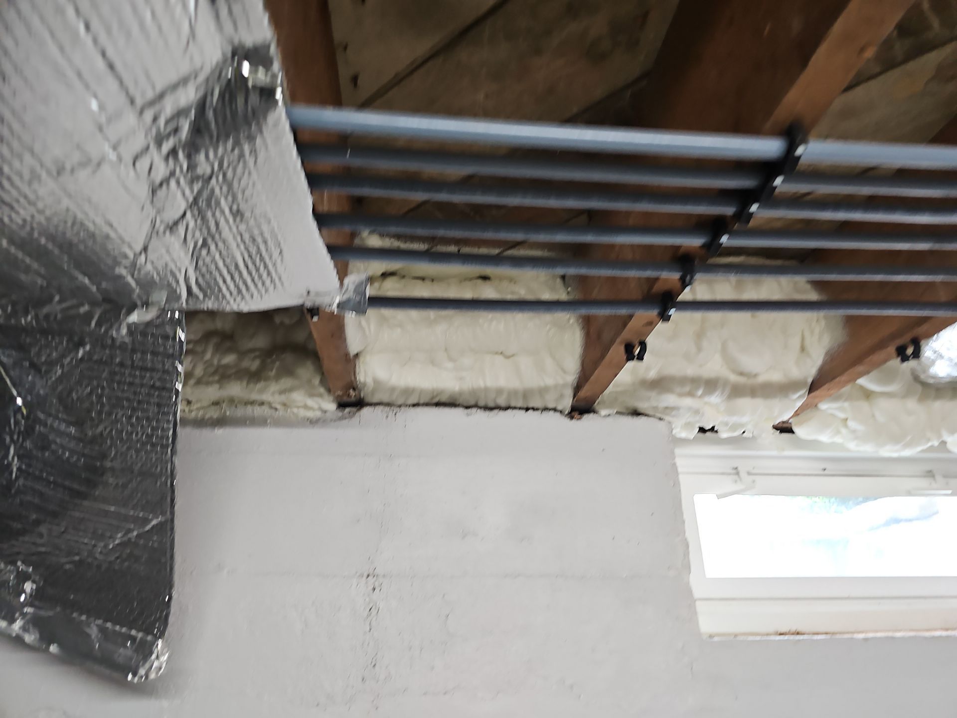 Attic Insulation using open cell spray foam by NYS Foam & Energy