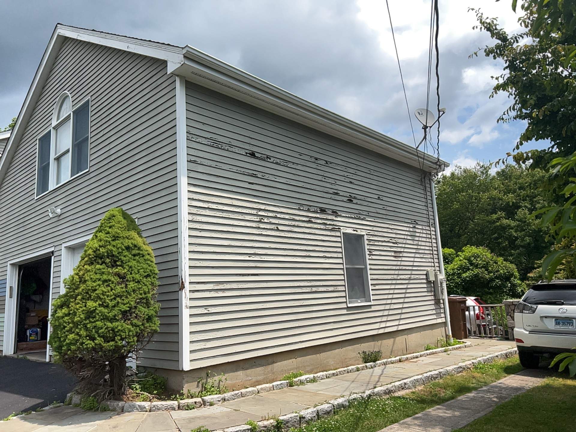 Siding Installation using Mainstreet Colonial & White gutters by A Plus Exterior