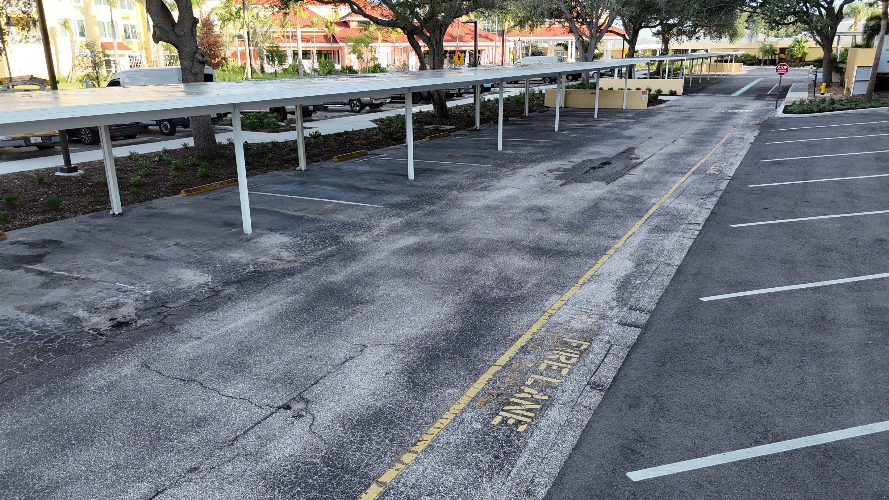 Comprehensive Parking Lot Mill and Overlay with Custom Line Striping in Venice by Everline Coatings & Services - Southwest FL
