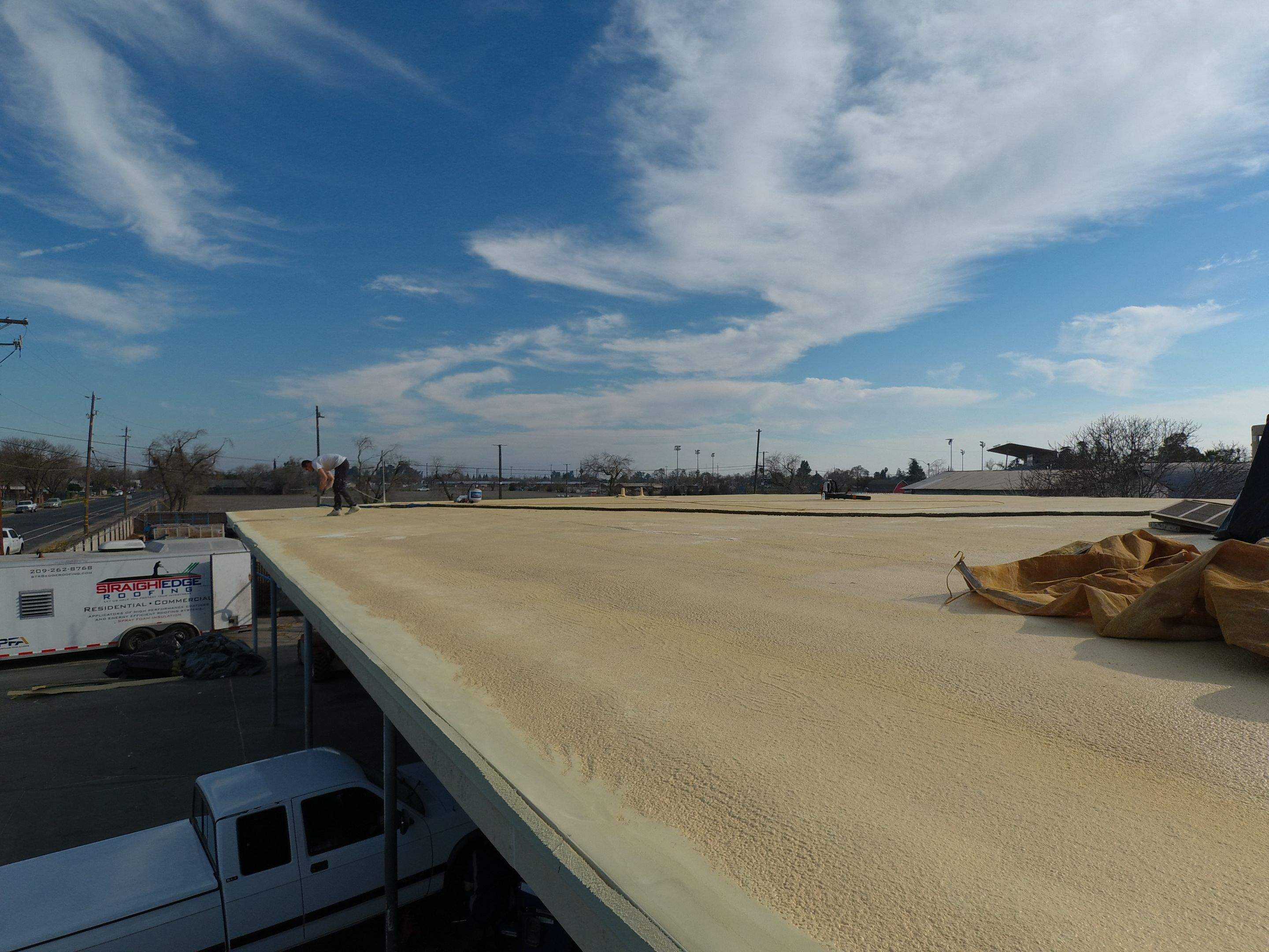 Spray foam and coatings using Conklin Benchmark/PUMA XL coatings and spray foam by Straight Edge Roofing Inc