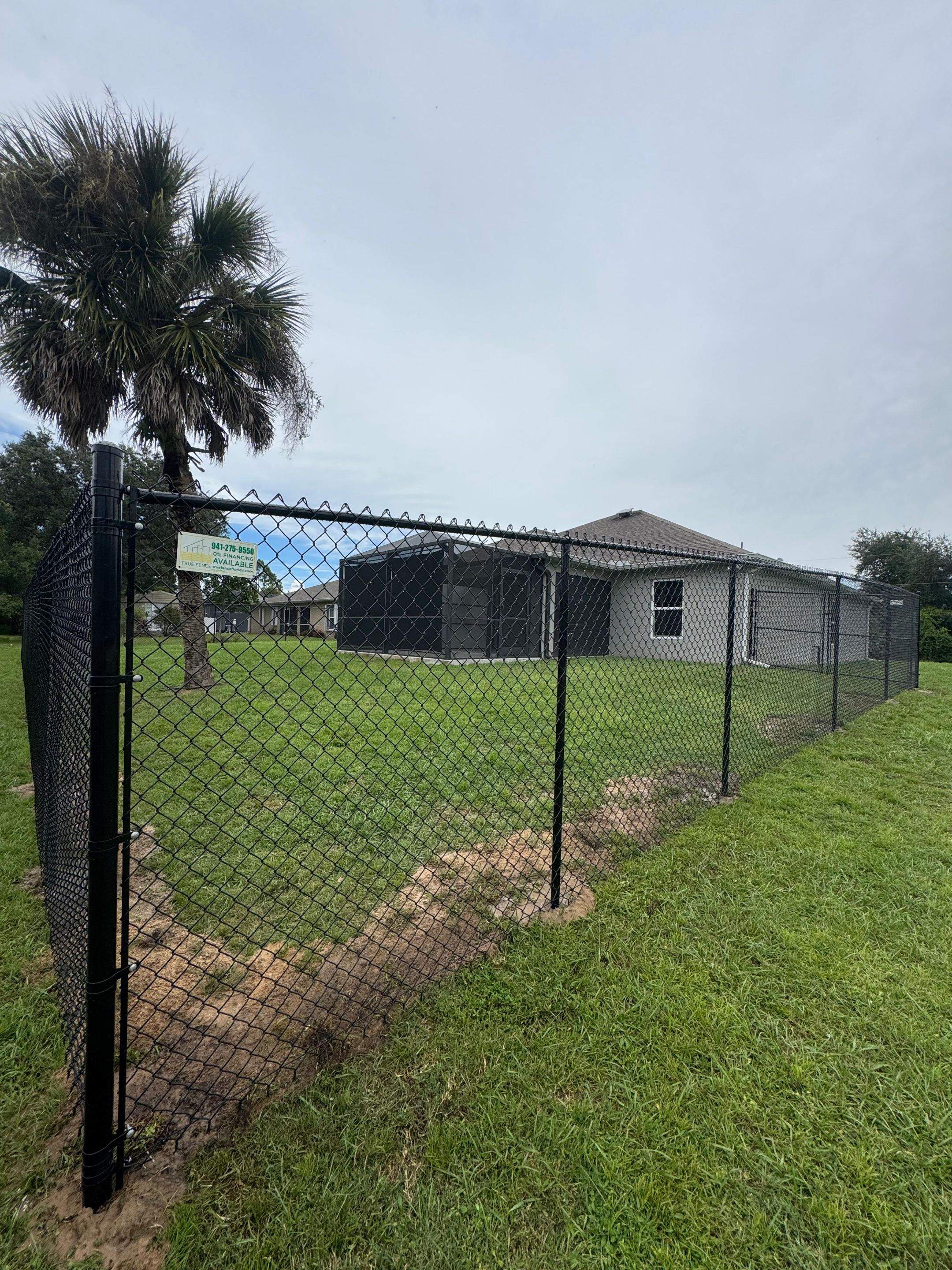 Black Chain Link Boundary Fence with Access Gates in North Port by True Fence LLC