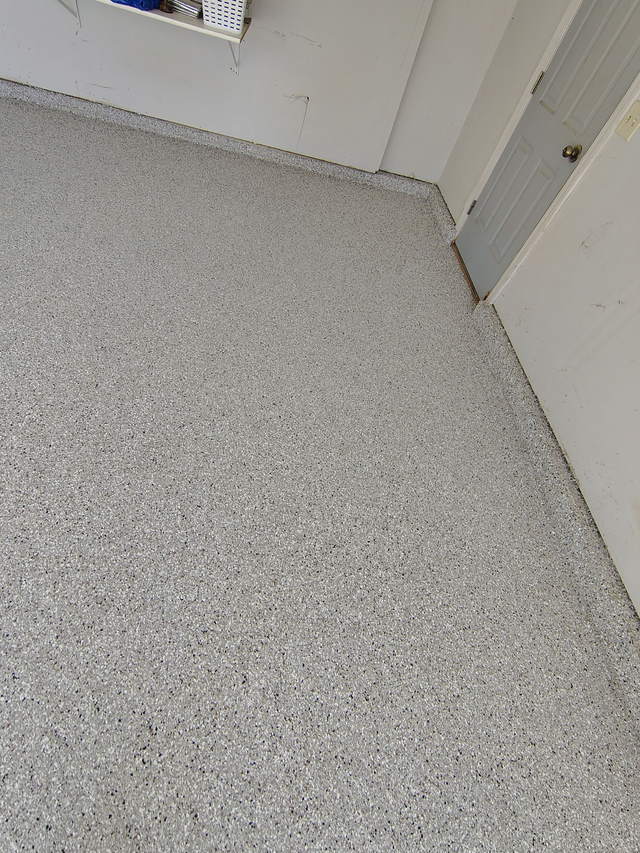 Decorative Chip Epoxy Garage Floor Coating in Sioux Falls by Select Painting, Coatings & Garage Cabinets