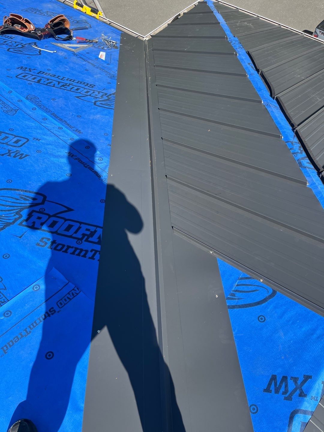 Residential Roofing Installation using 12" Prolok metal  by Top Notch Roofing Inc