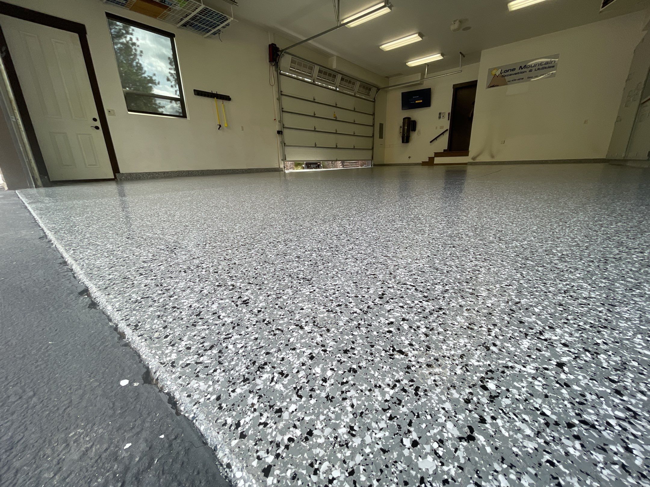 Garage Transformation using Smoke and the Penntek Evolution System by Croc Coatings, LLC