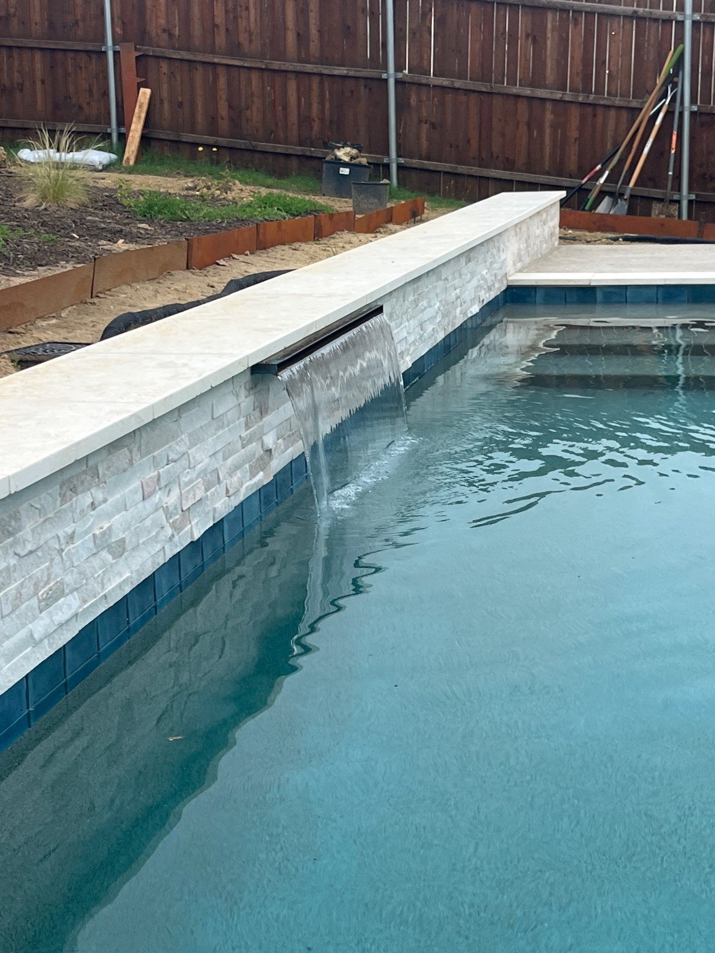 Geometric Pool with Raised Water Feature Wall by Pinnacle Pools and Spas - DFW