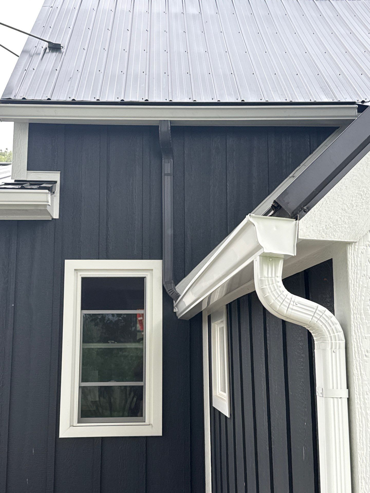 Seamless Gutter and Gutter Helmet Installation on Bellaire Metal Roof by Rainbow Seamless Systems
