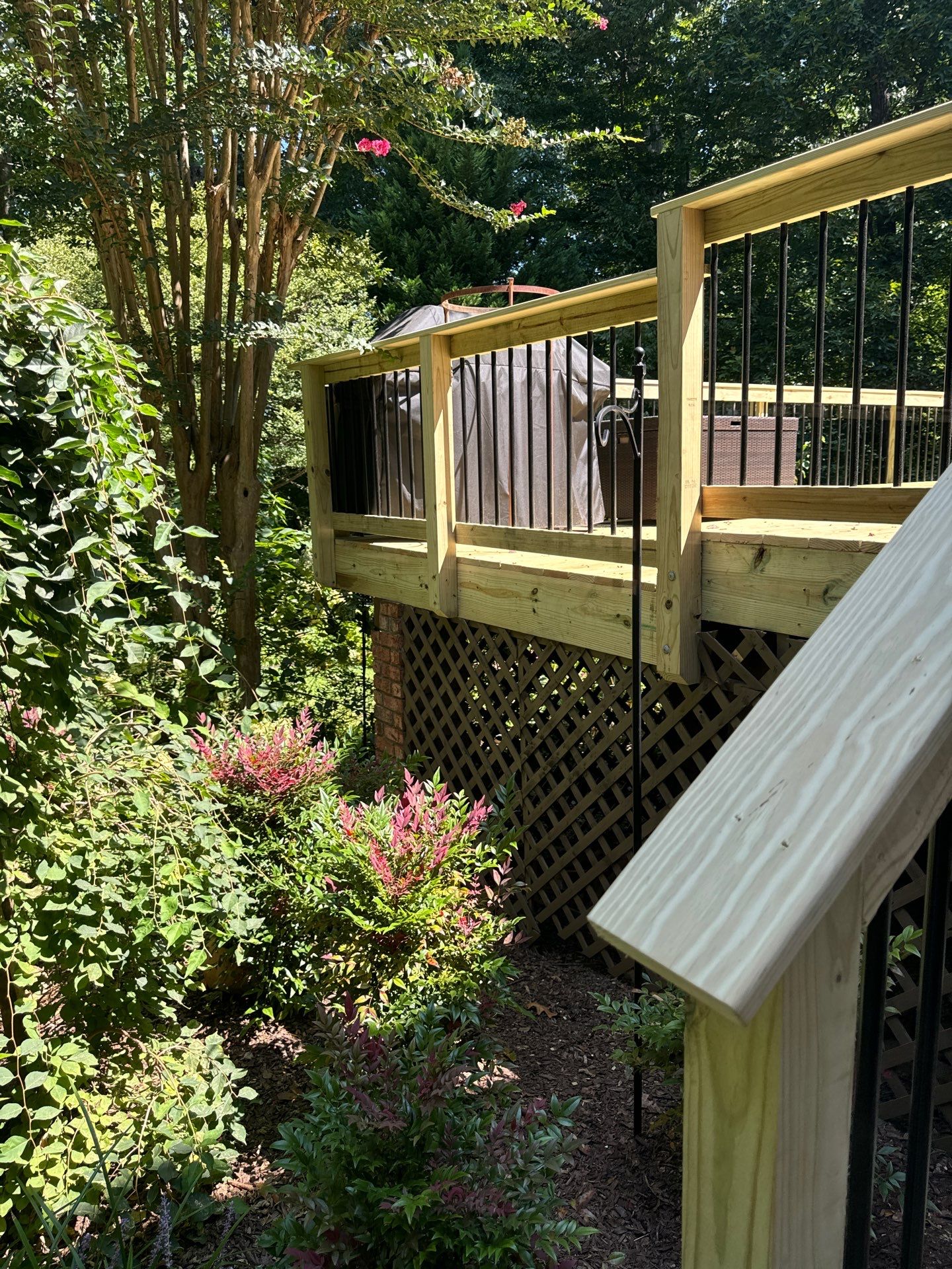 Pressure-Treated Deck Resurface with Black Aluminum Balusters in Broadway by The Remodeling Company