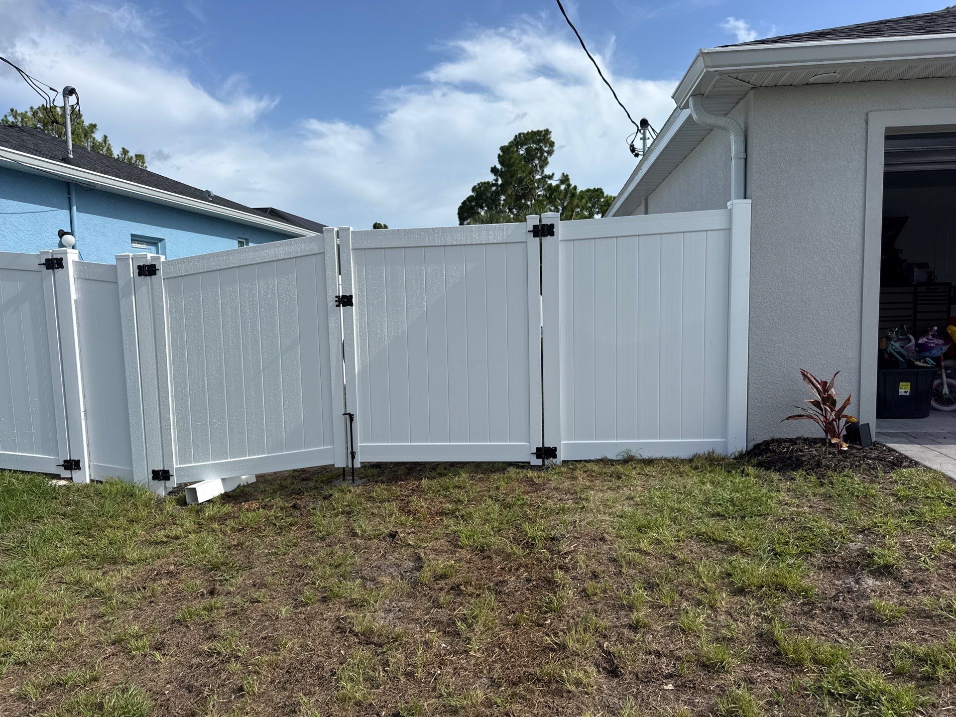 White Vinyl Privacy Fence and Gate Installation in Port Charlotte by True Fence LLC