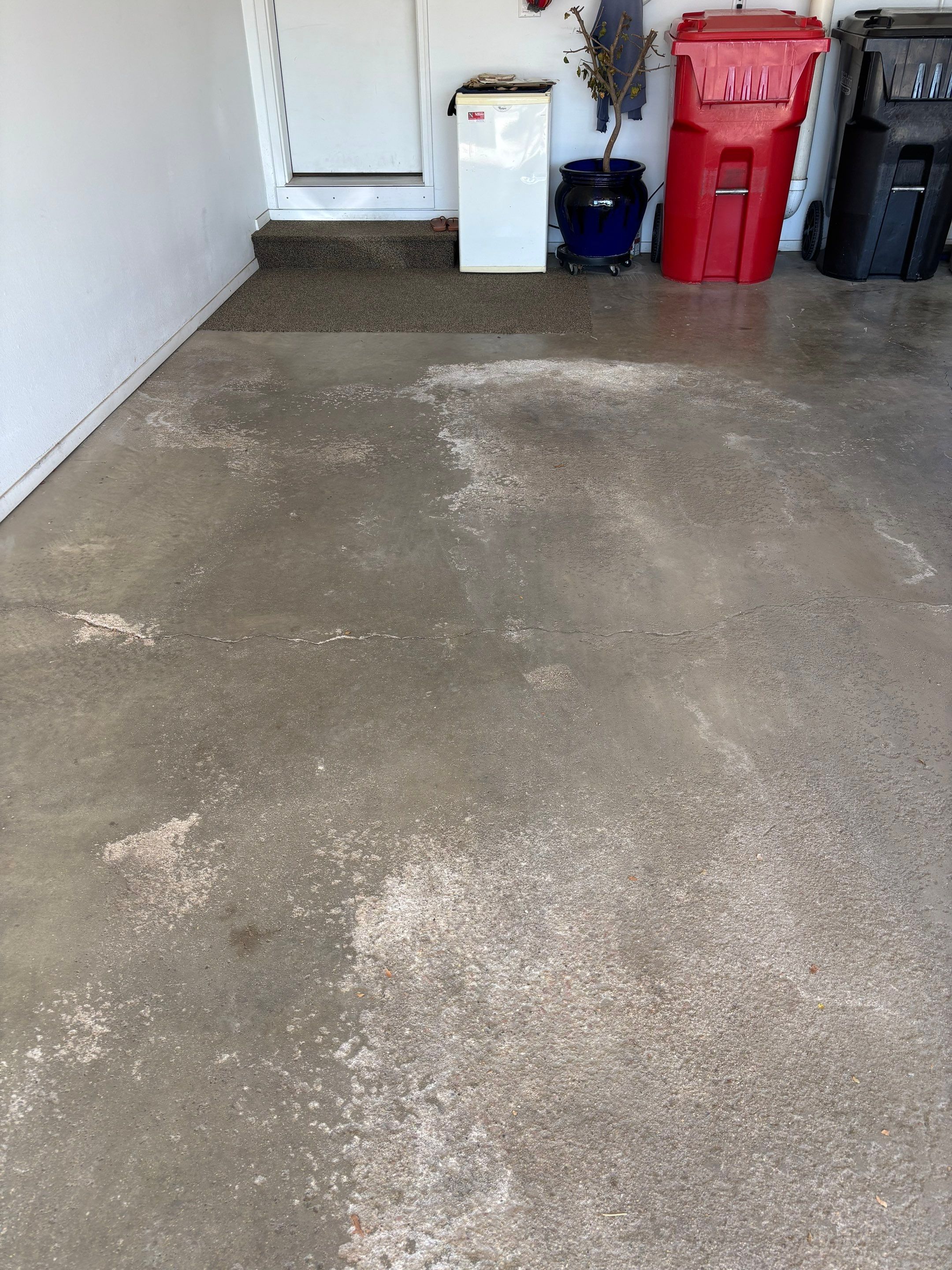 Yankton Garage Floor Restoration with Gray Speckled Epoxy Coating by Select Painting, Coatings & Garage Cabinets