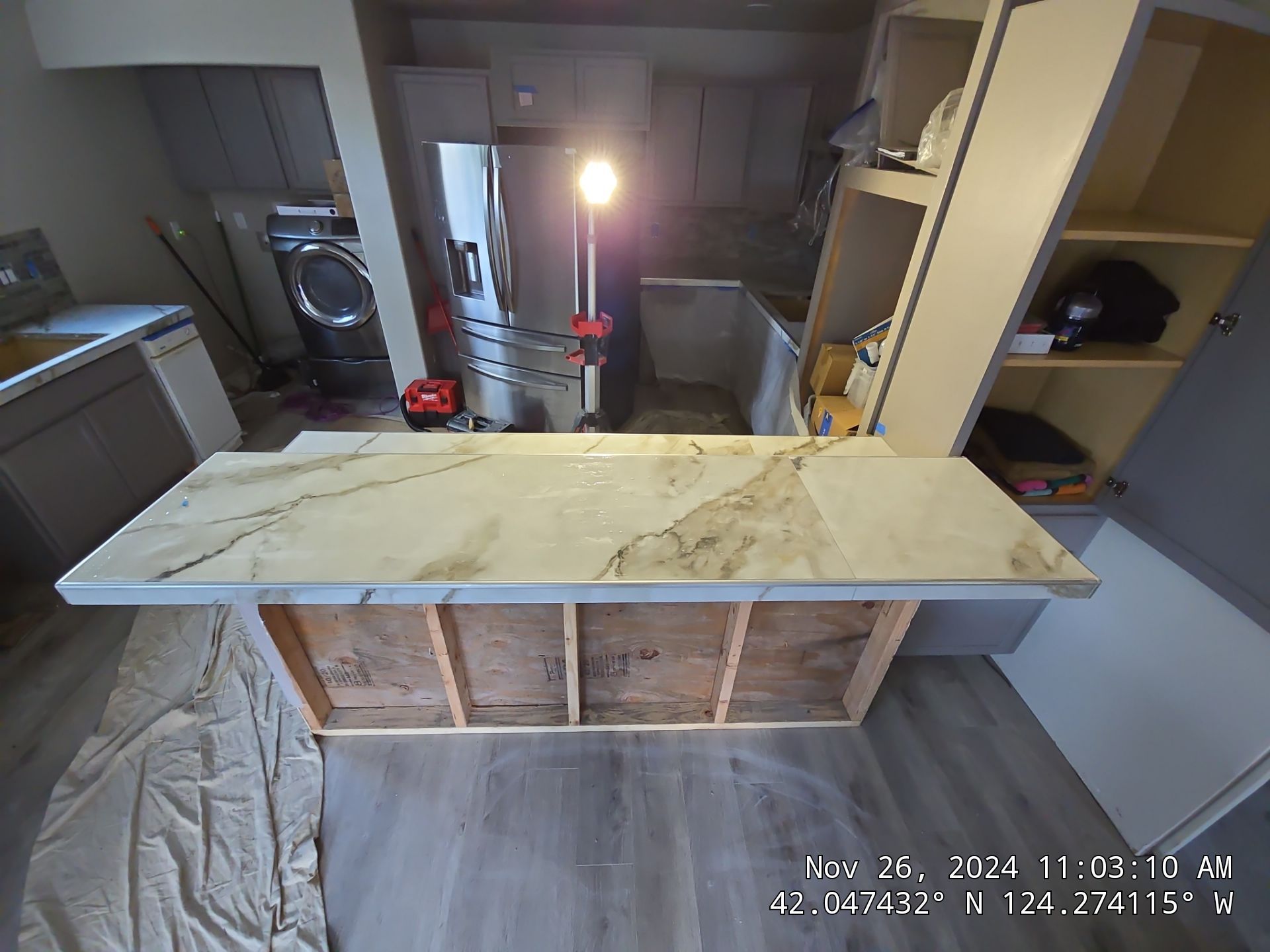 Marble Look Countertop and Stone Tile Backsplash Installation in Brookings by KMD Surfaces INC.