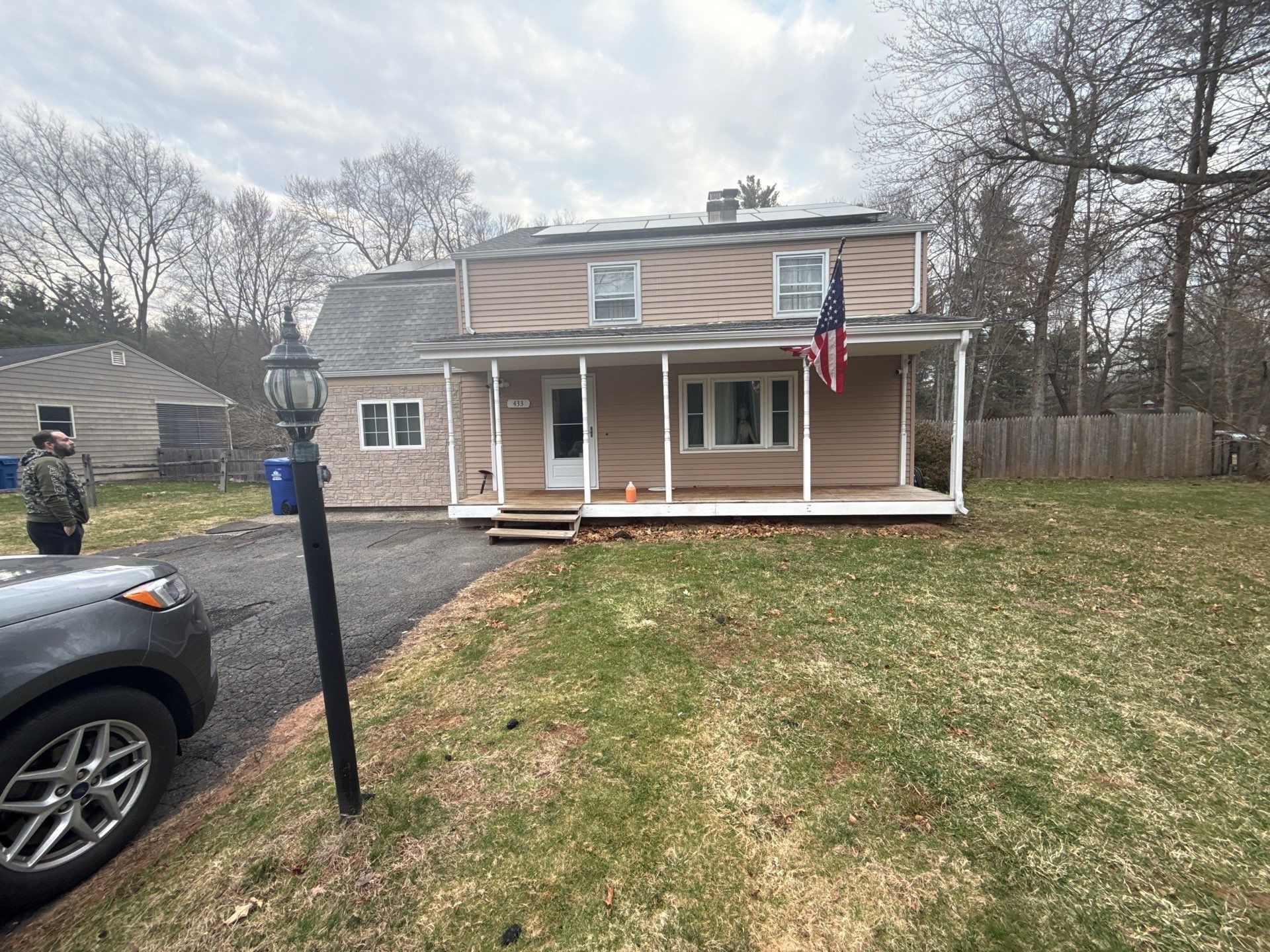 Exterior Home Renovation Underway in Southington: Siding, Stone Accents, and Solar Roof by Diamond Image LLC