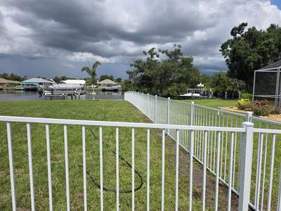 White Aluminum Picket Fence Installation for Port Charlotte Waterfront Home