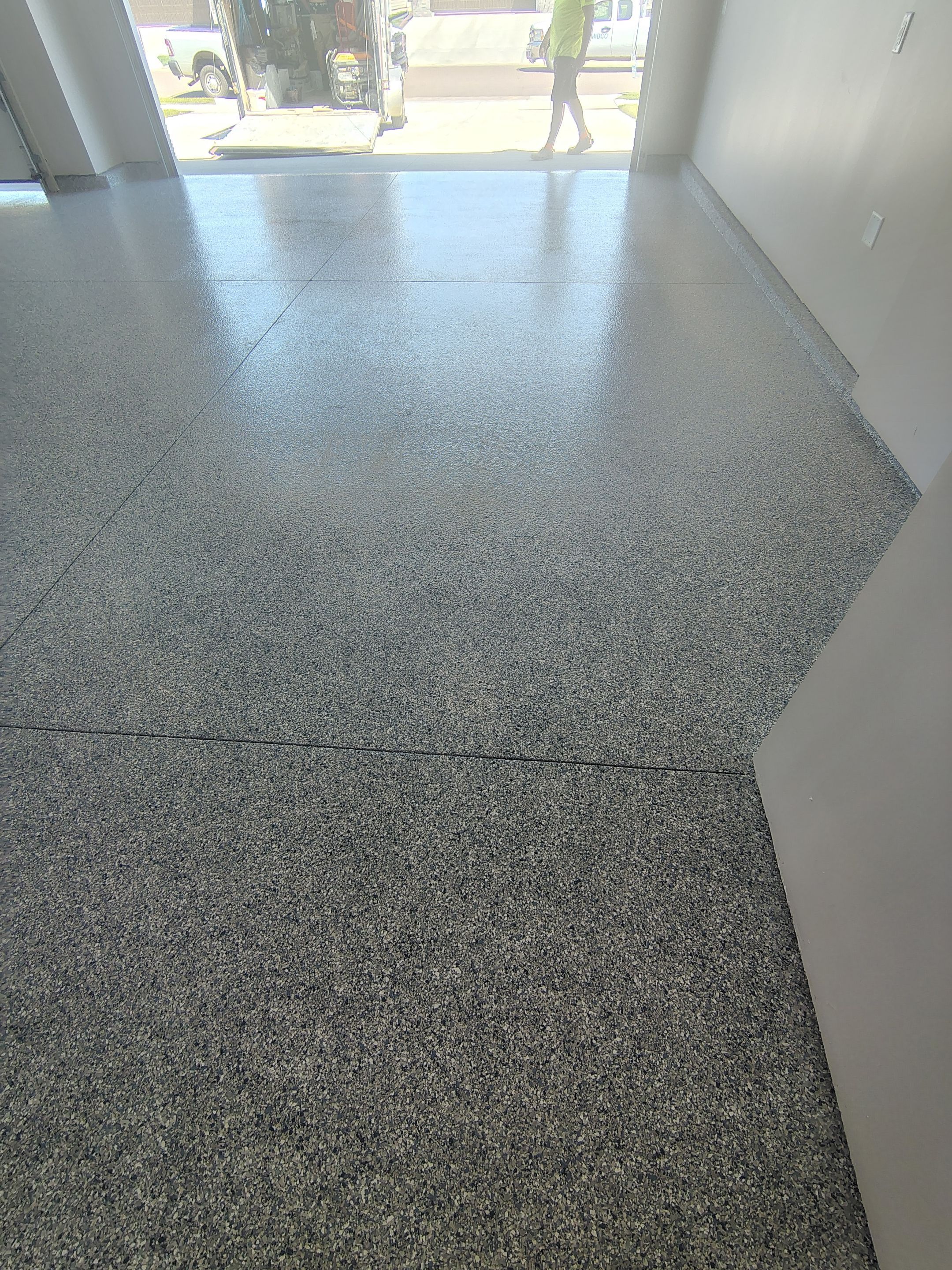 Full Speckled Concrete Coating for Sioux Falls Garage by Select Painting, Coatings & Garage Cabinets