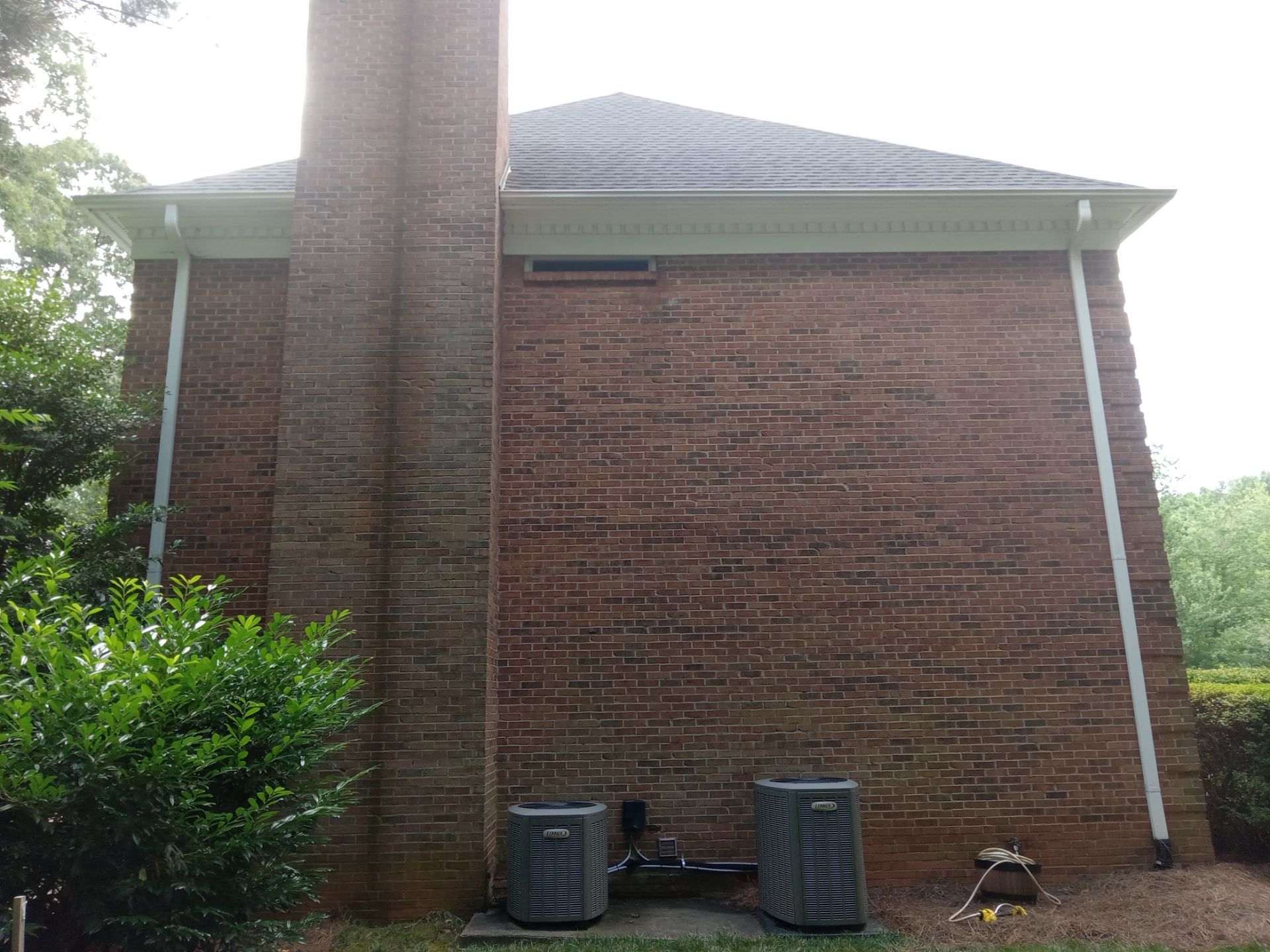 pressure washing company cleaning exterior brick wall surfaces removing dirt mildew for home maintenance and curb appeal