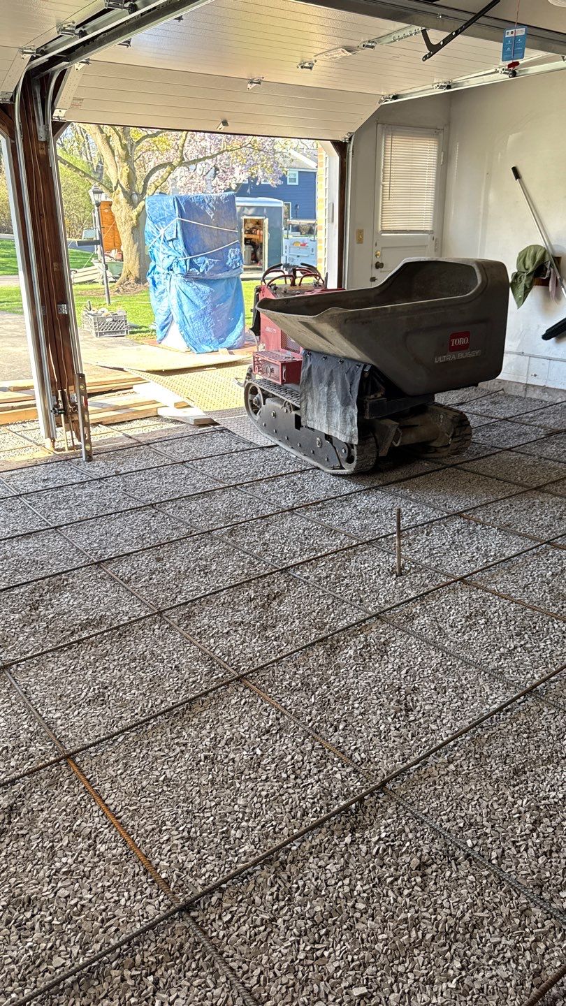 Concrete garage floor replacement with a broom finished apron by NG Masonry & Construction LLC