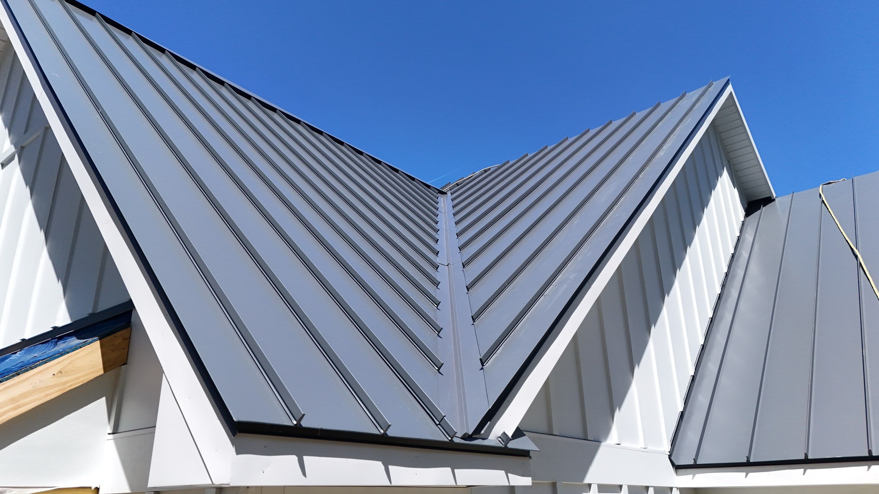 Custom New Construction Home Featuring Standing Seam Metal Roofing in Port Haywood by Cade Construction