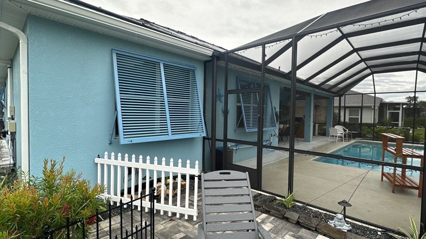 Hurricane Rated Shutters in Pastel Blue by Smart Guard Shutters